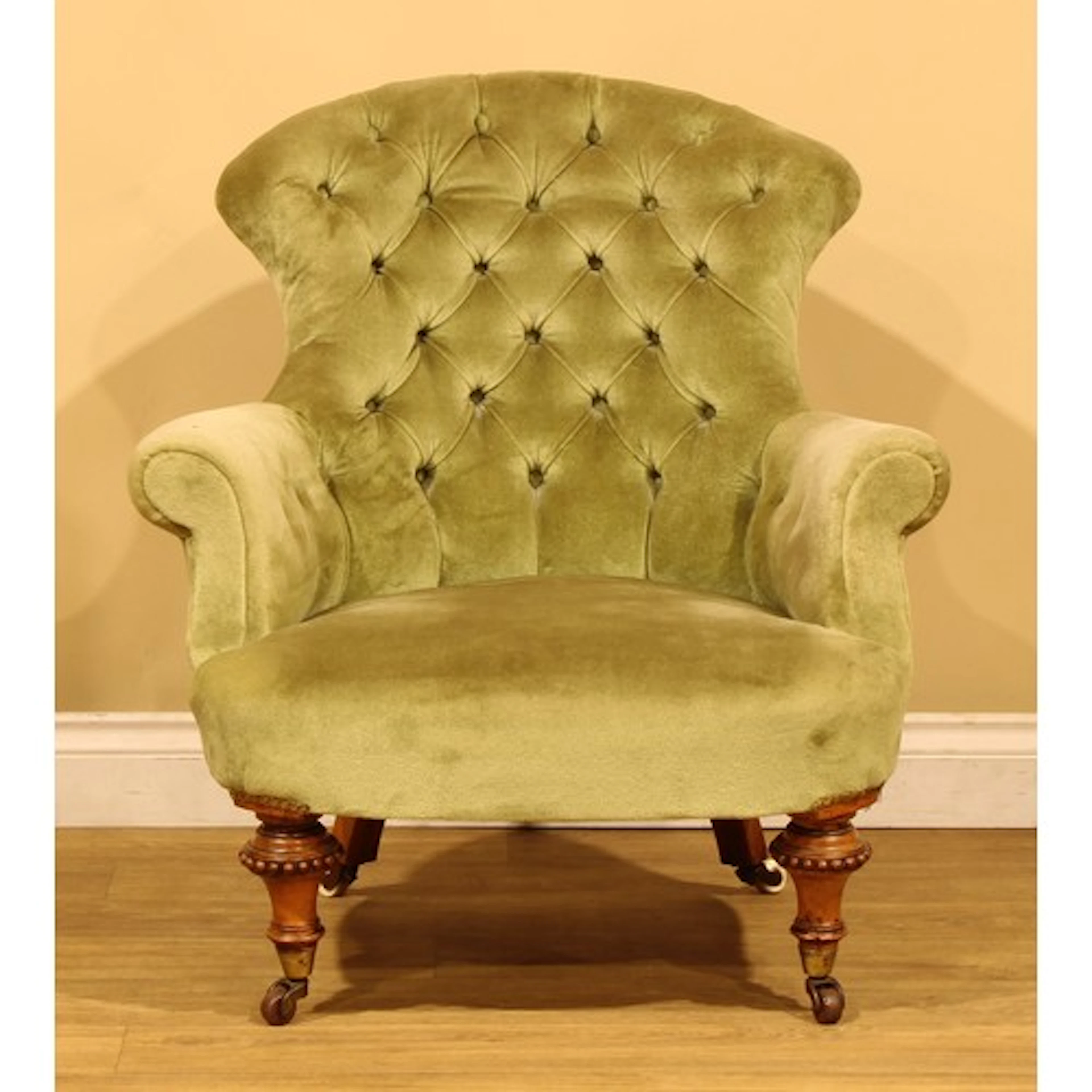 A Victorian crapaud form low club chair, stuffed-over uphols...