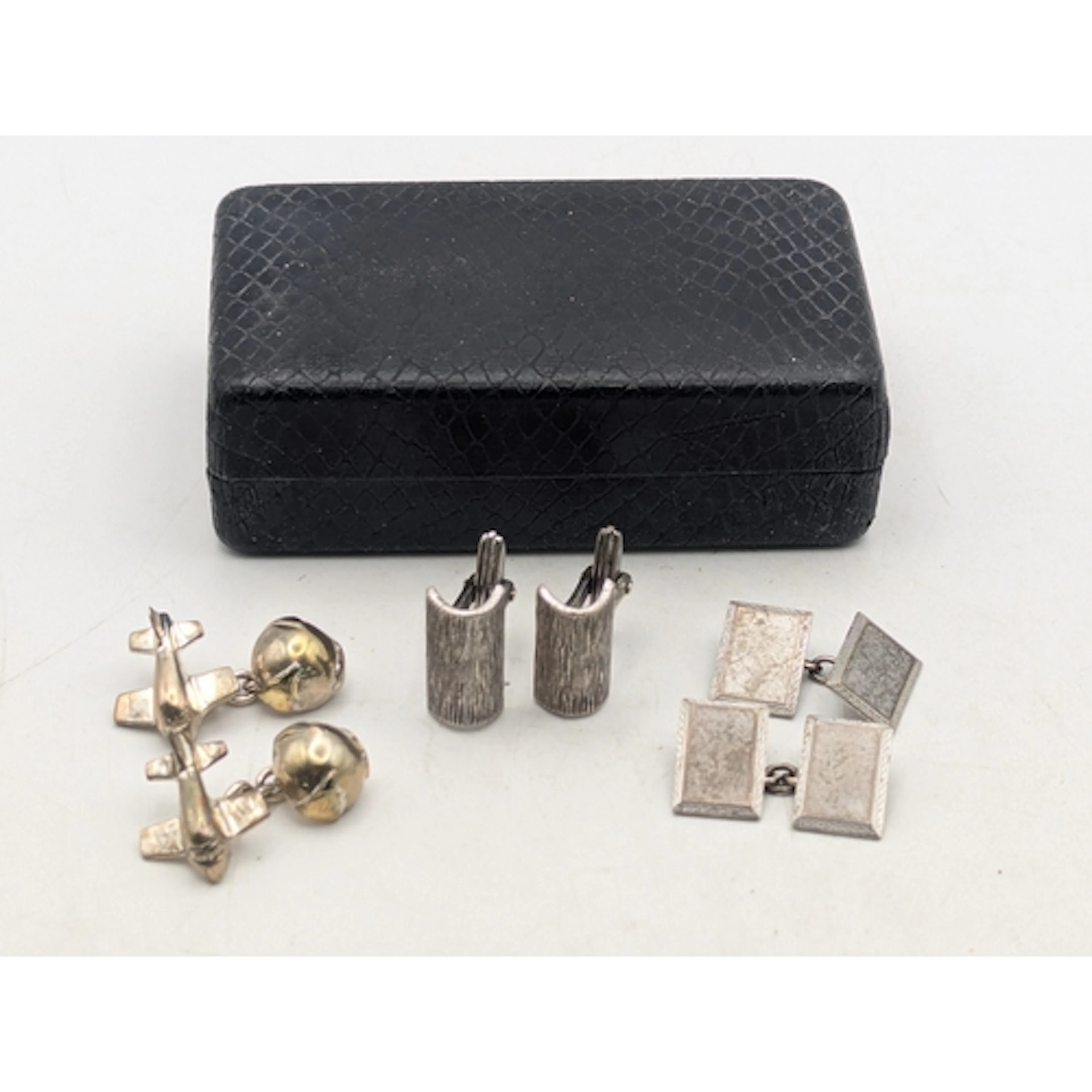 Three pairs of silver cuff links to include a pair of airpla...