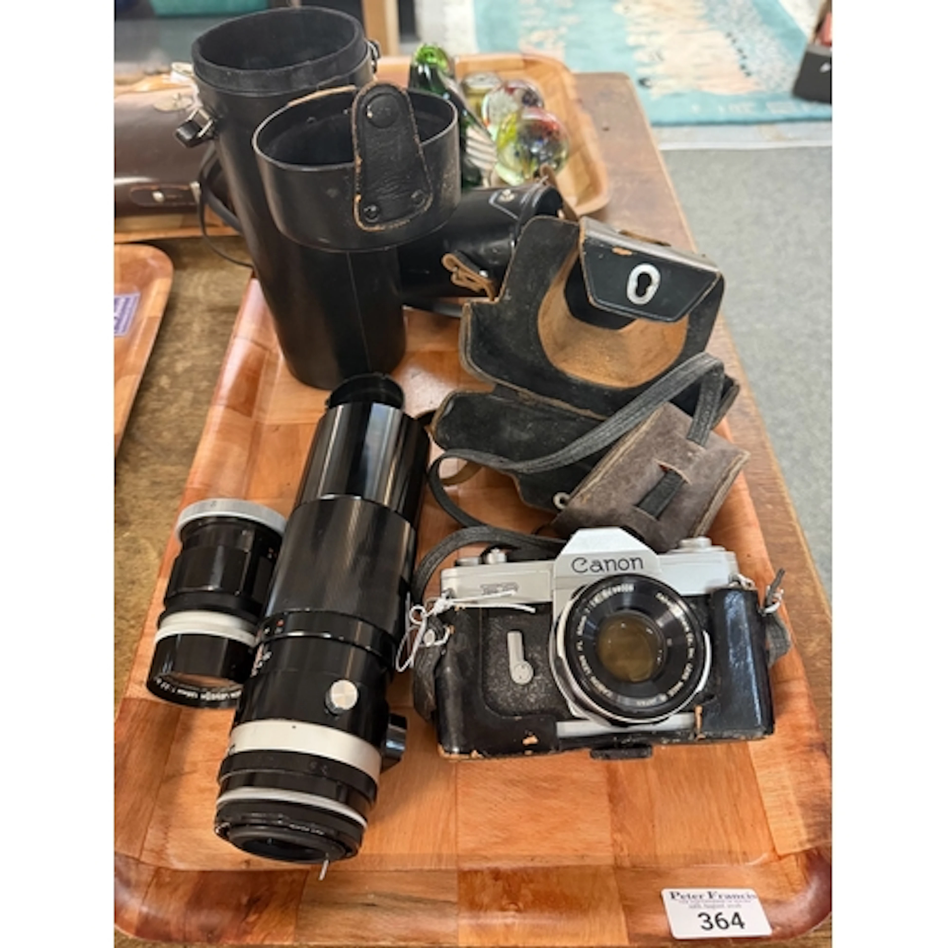 Vintage Canon FP camera with various lenses including Auto T...