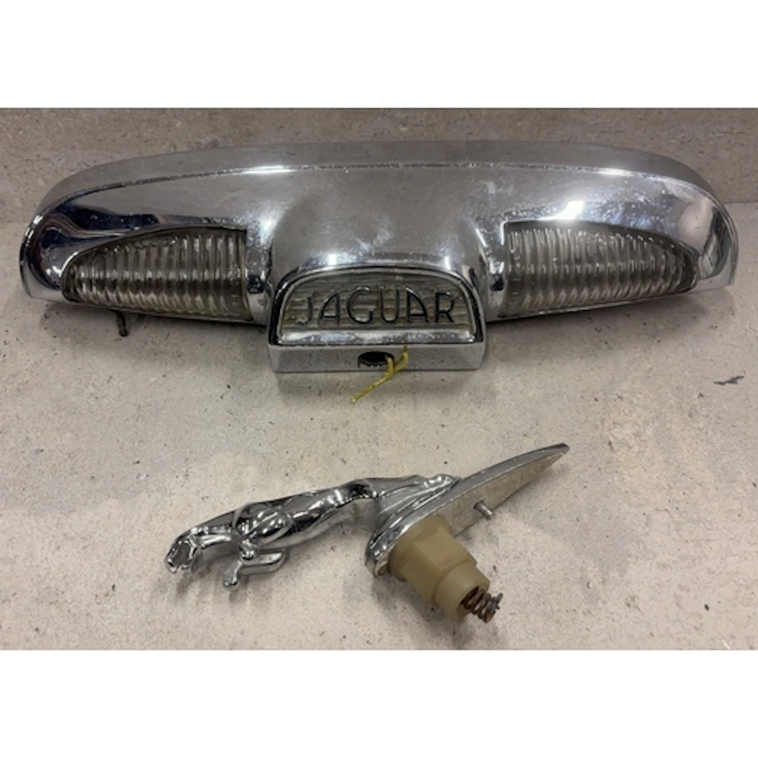 A Jaguar "MK10" boot plinth together with a 5" Jaguar bonnet...
