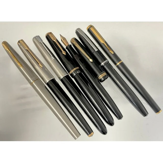 A group of seven fountain pens, Parker, and a Conway Stewart...