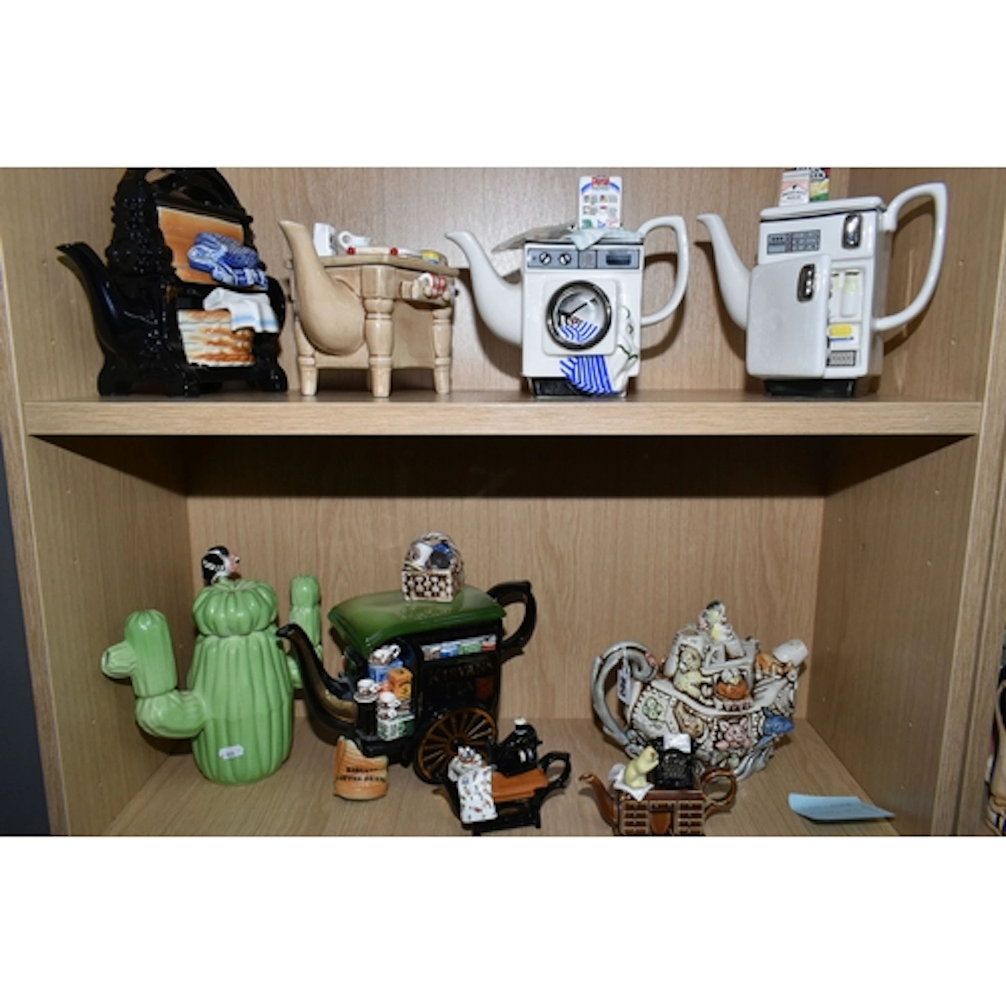 A GROUP OF VINTAGE PAUL CARDEW NOVELTY TEAPOTS, comprising a...