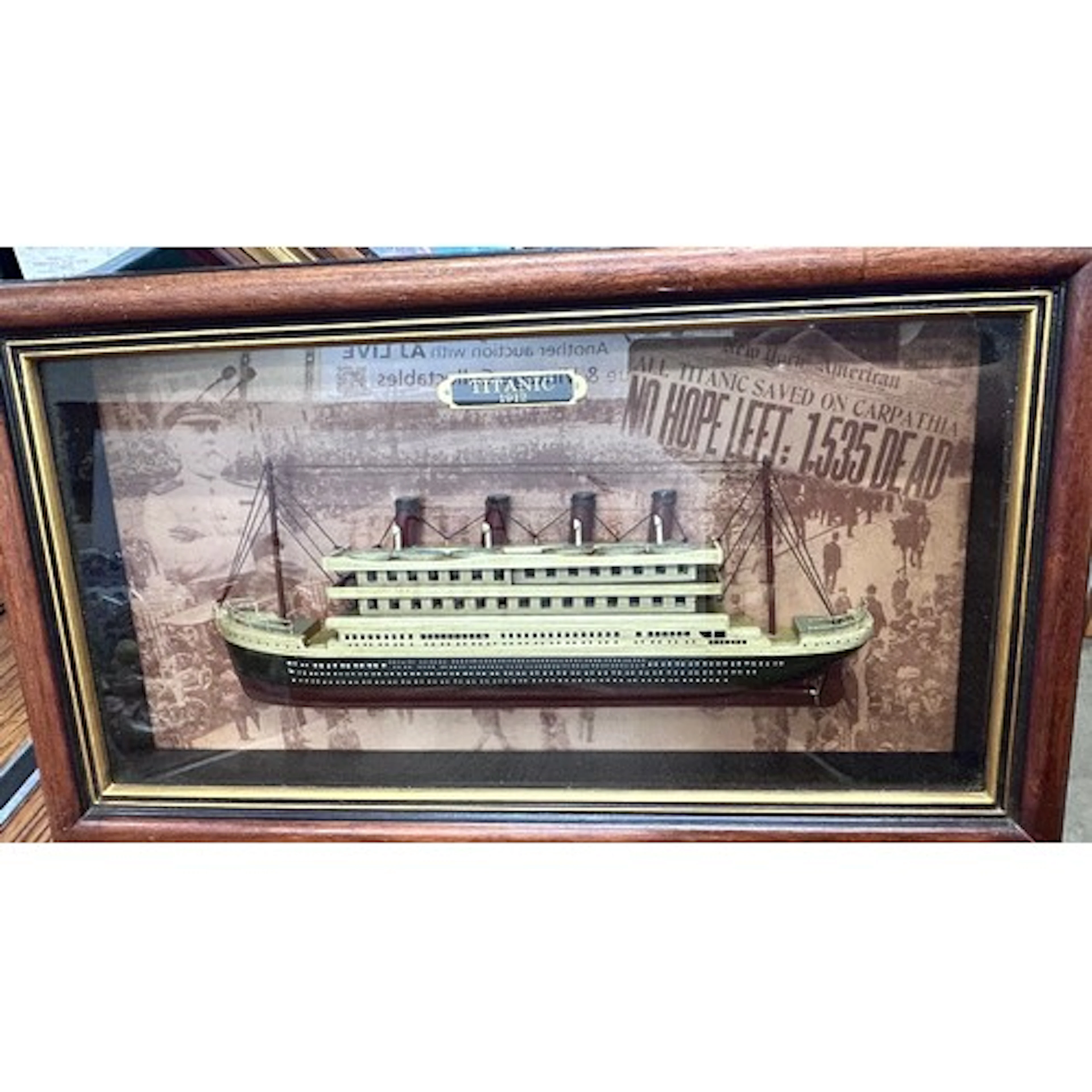 A framed print of the Titanic by Edward Walker, with other f...