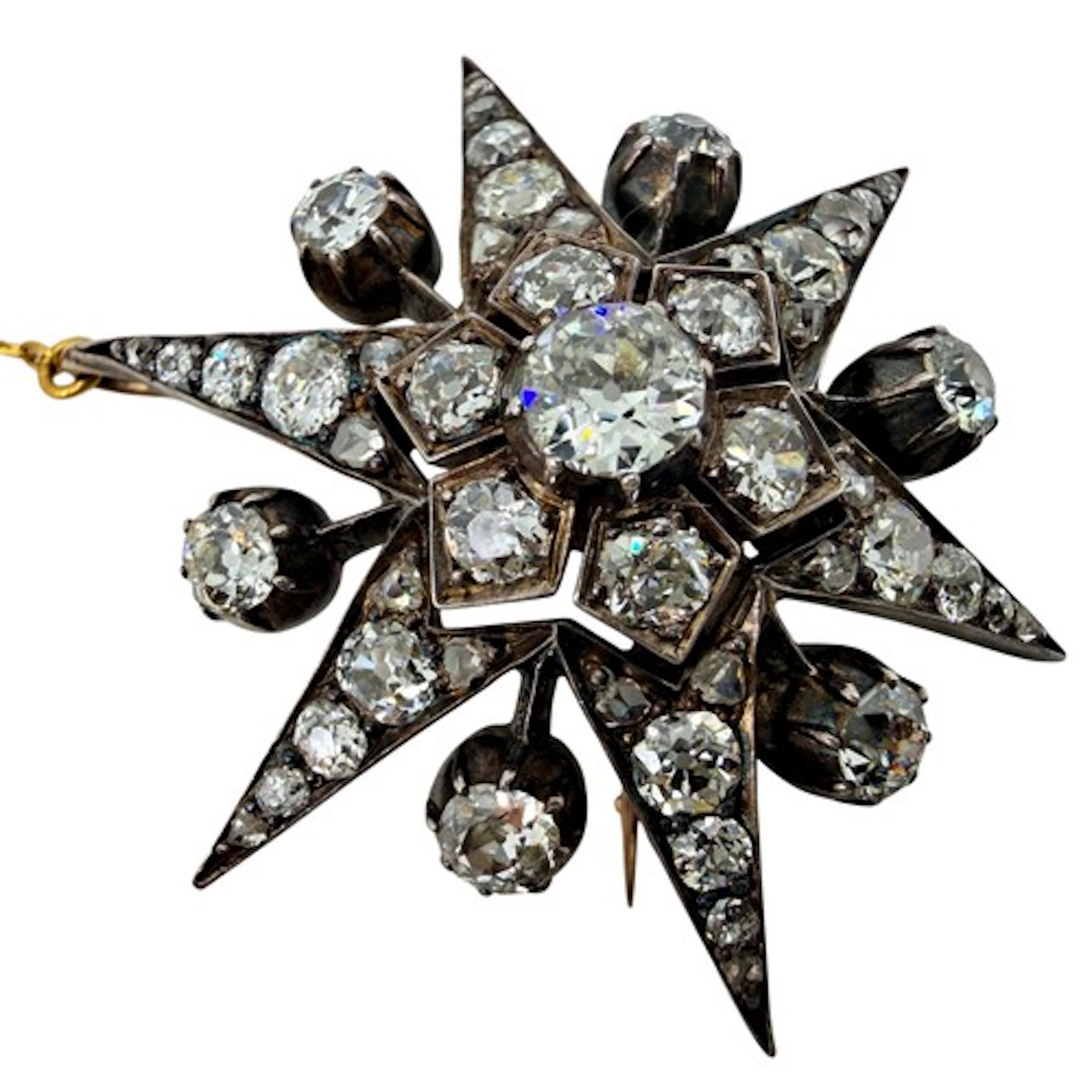 A 19th century diamond starburst brooch, set throughout with...