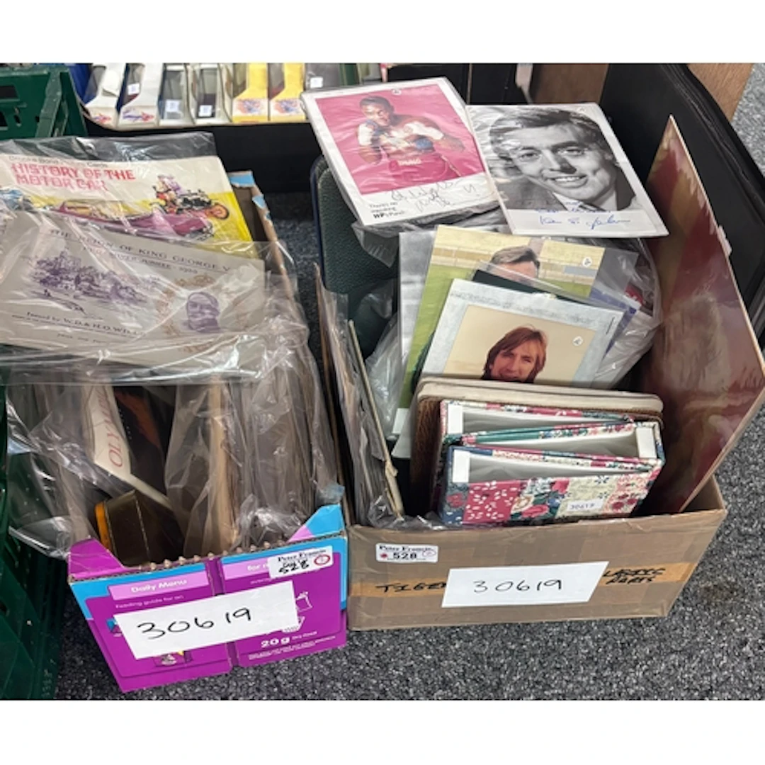 Two boxes of assorted cigarette cards, empty cigarette album...