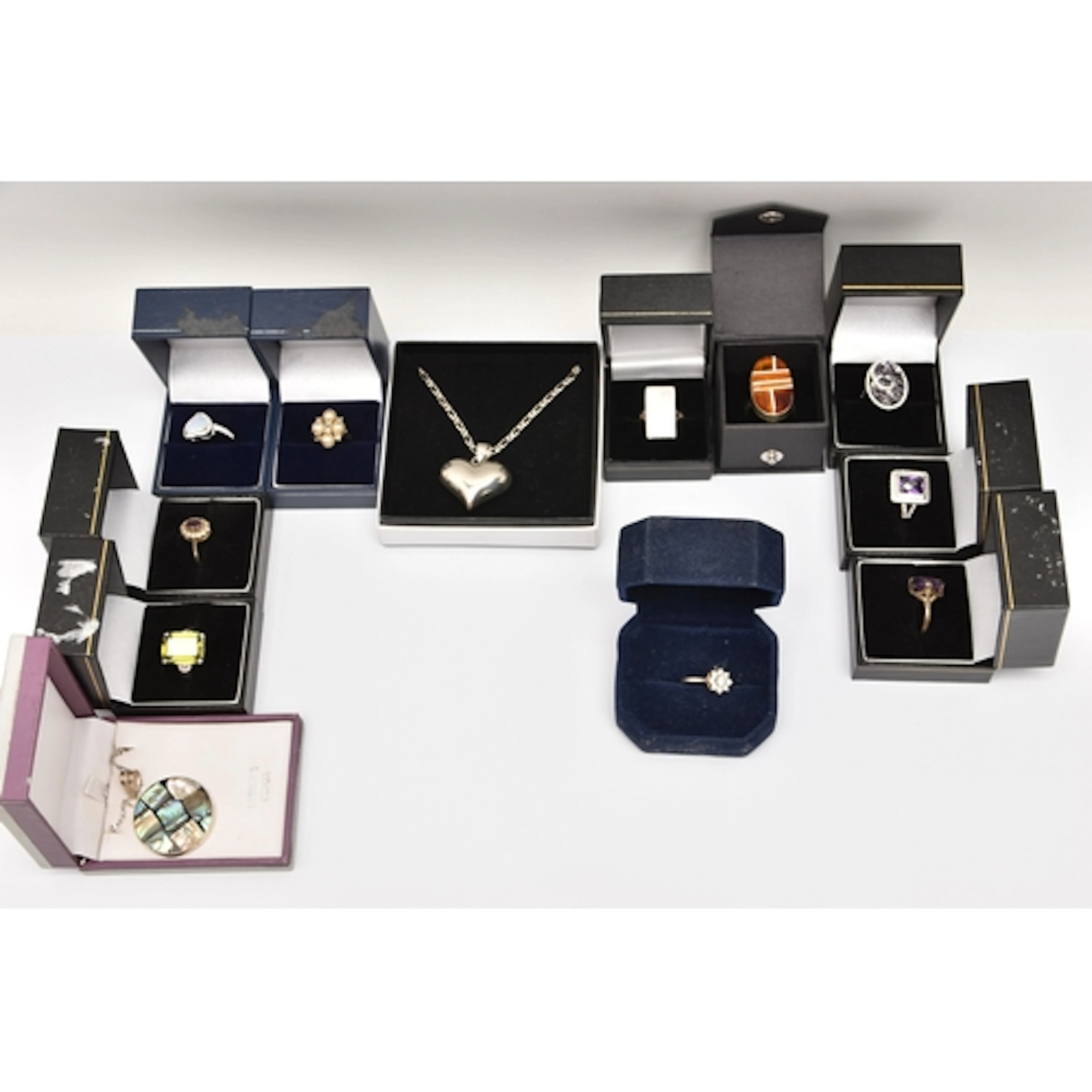 A BOX OF ASSORTED JEWELLERY, to include ten boxed white meta...