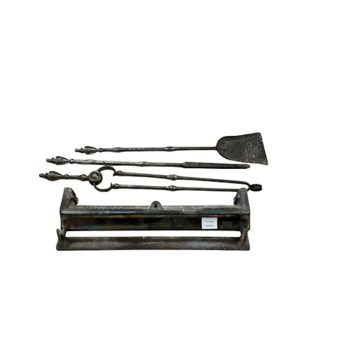 A George III polished steel fire companion set, fire curb wi...
