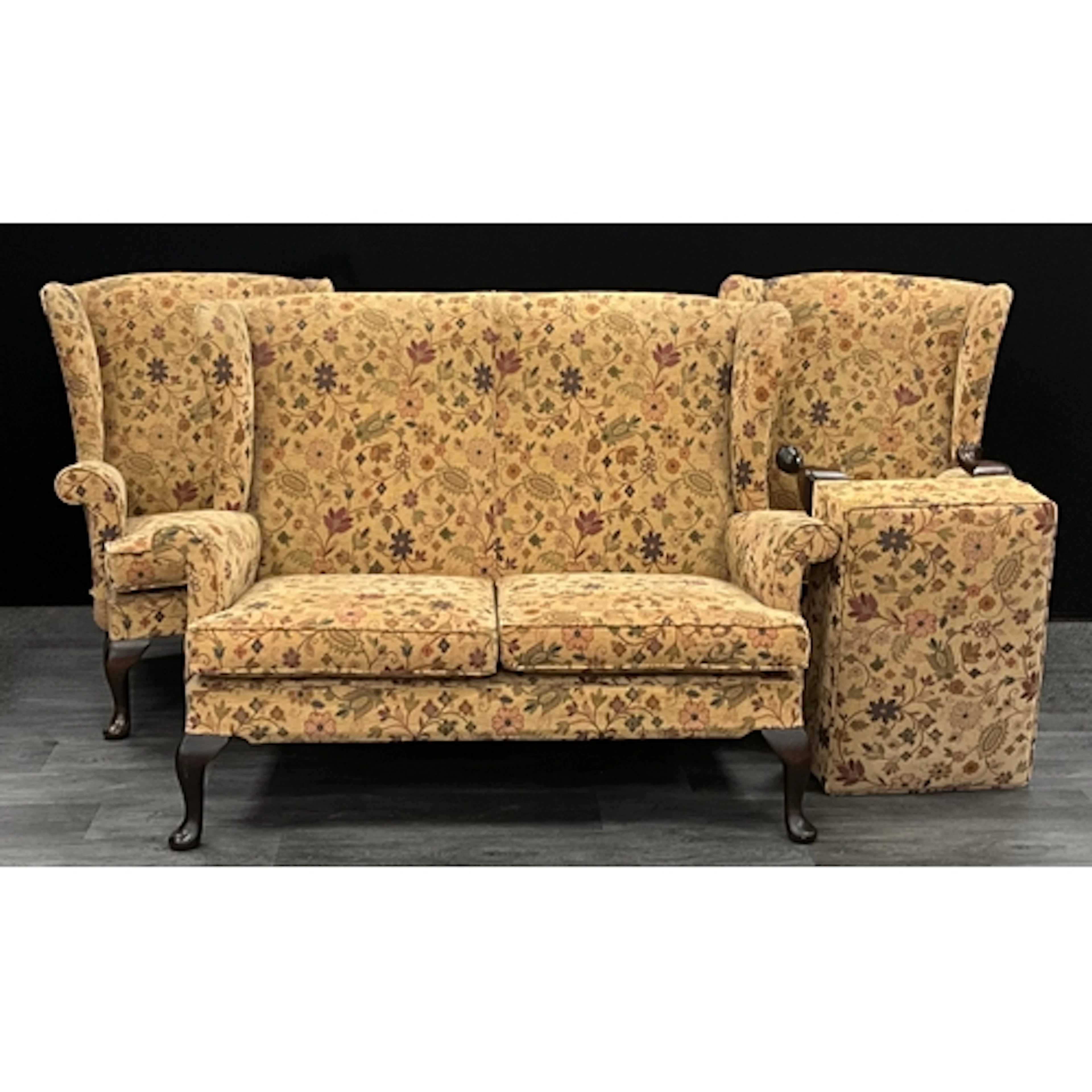 A mid century Parker Knoll wingback lounge suit, comprising ...