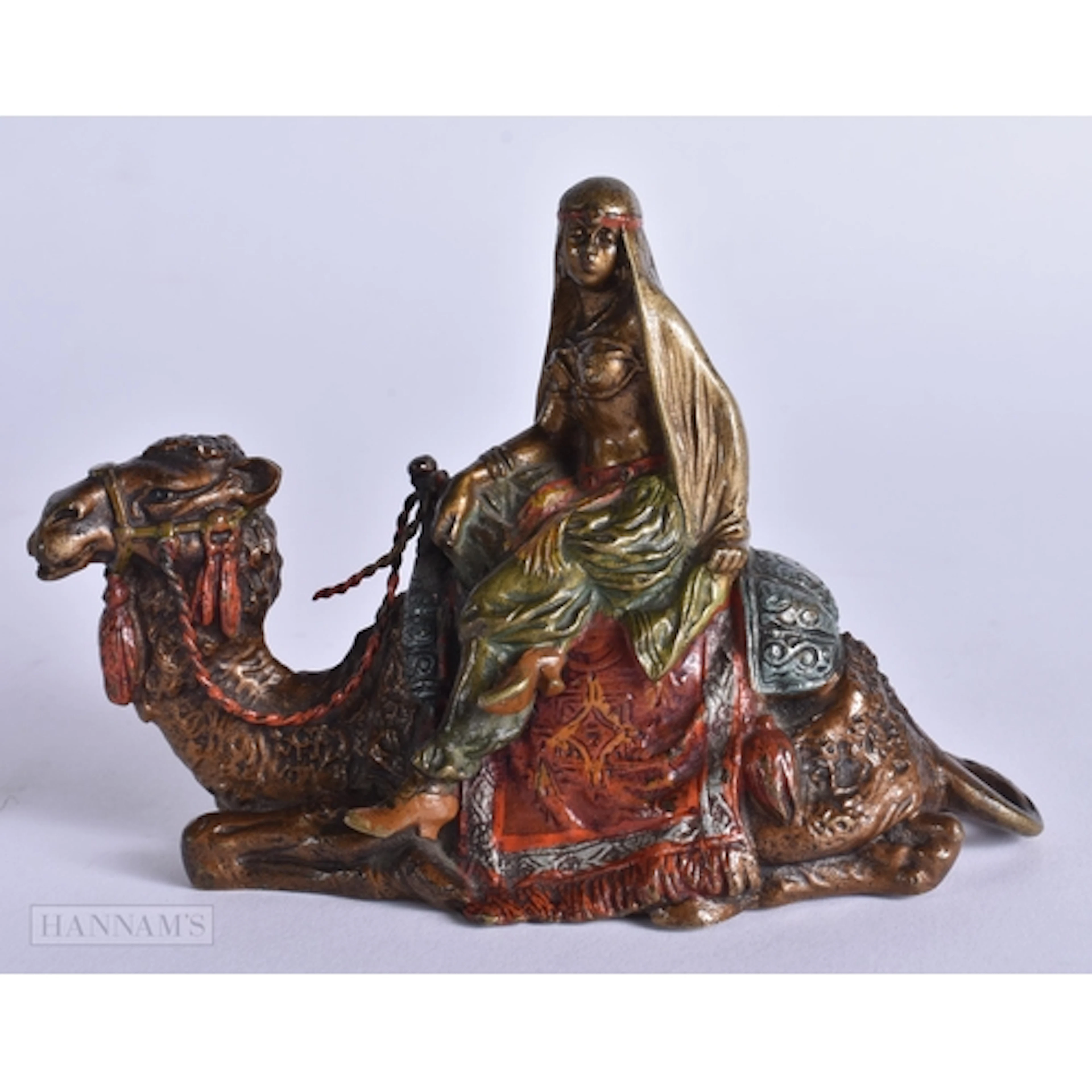 AN ANTIQUE COLD PAINTED BRONZE ARABIC CAMEL GROUP. 13 cm x 9...