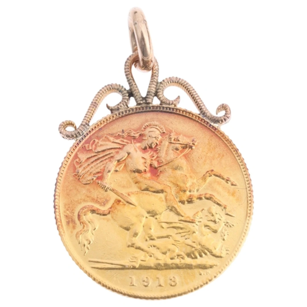 A George V 1913 gold half sovereign coin, with soldered pend...