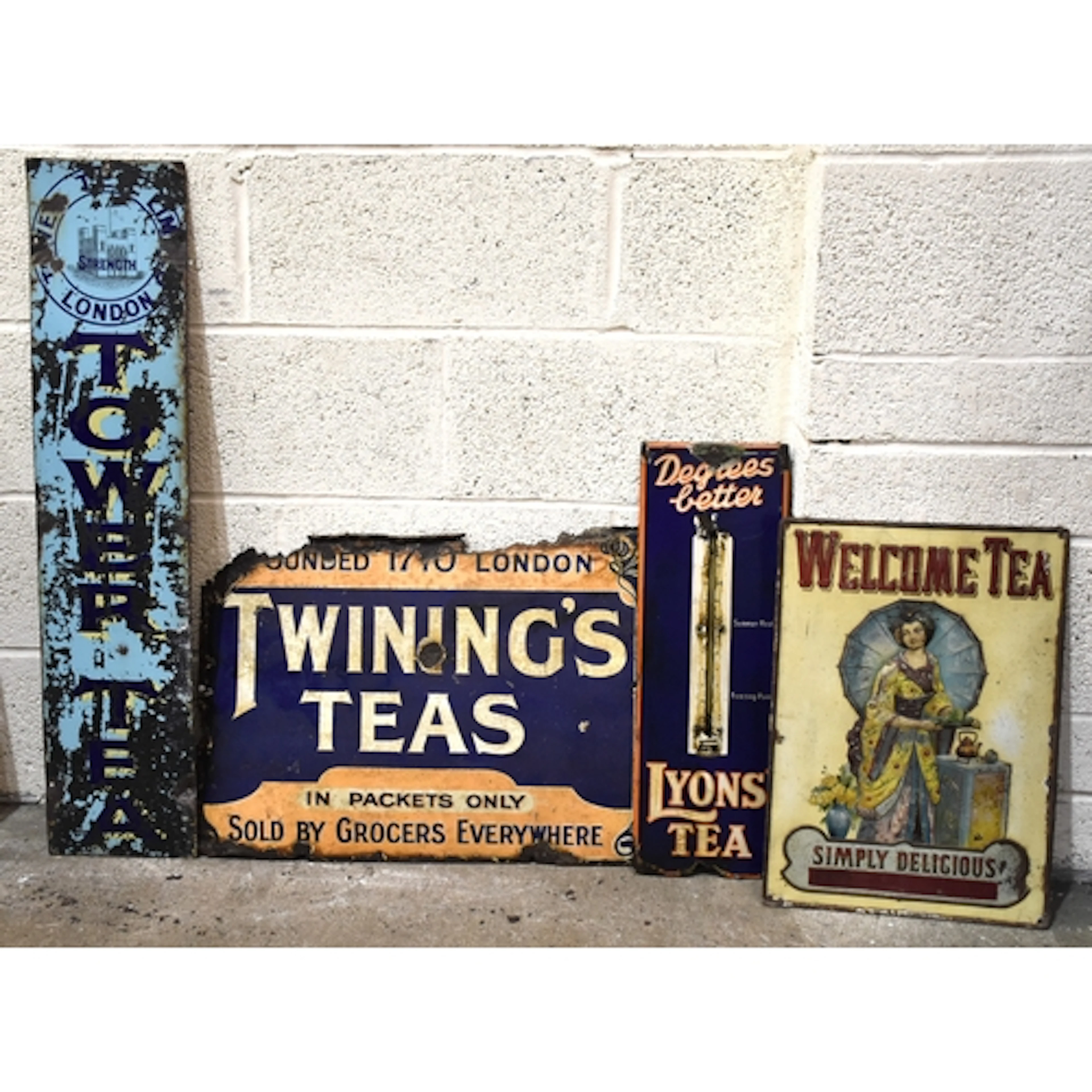 Three enamelled advertising signs: "Degrees Better, Lyon's T...