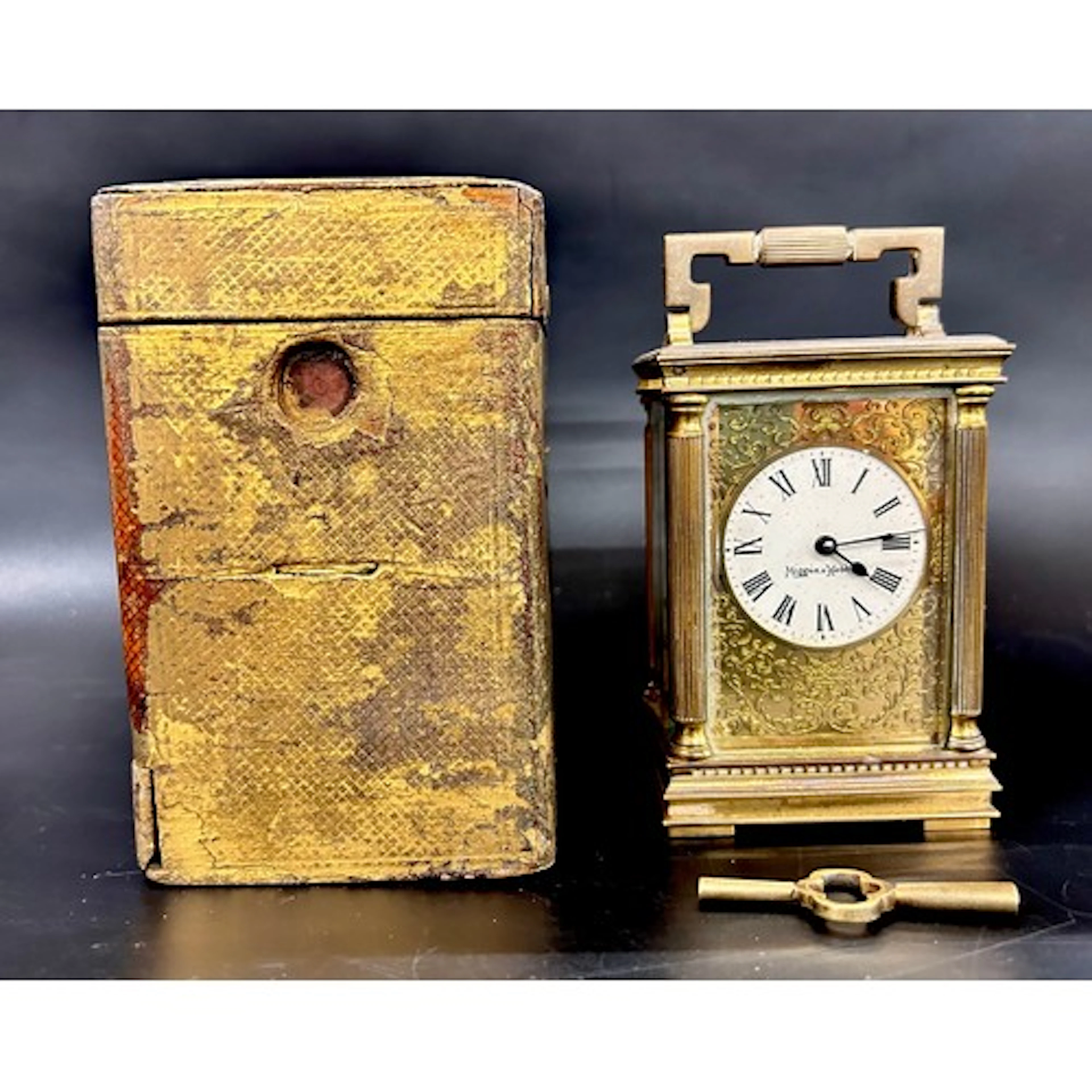 A Mappin & Webb decorative brass carriage clock, with key, i...