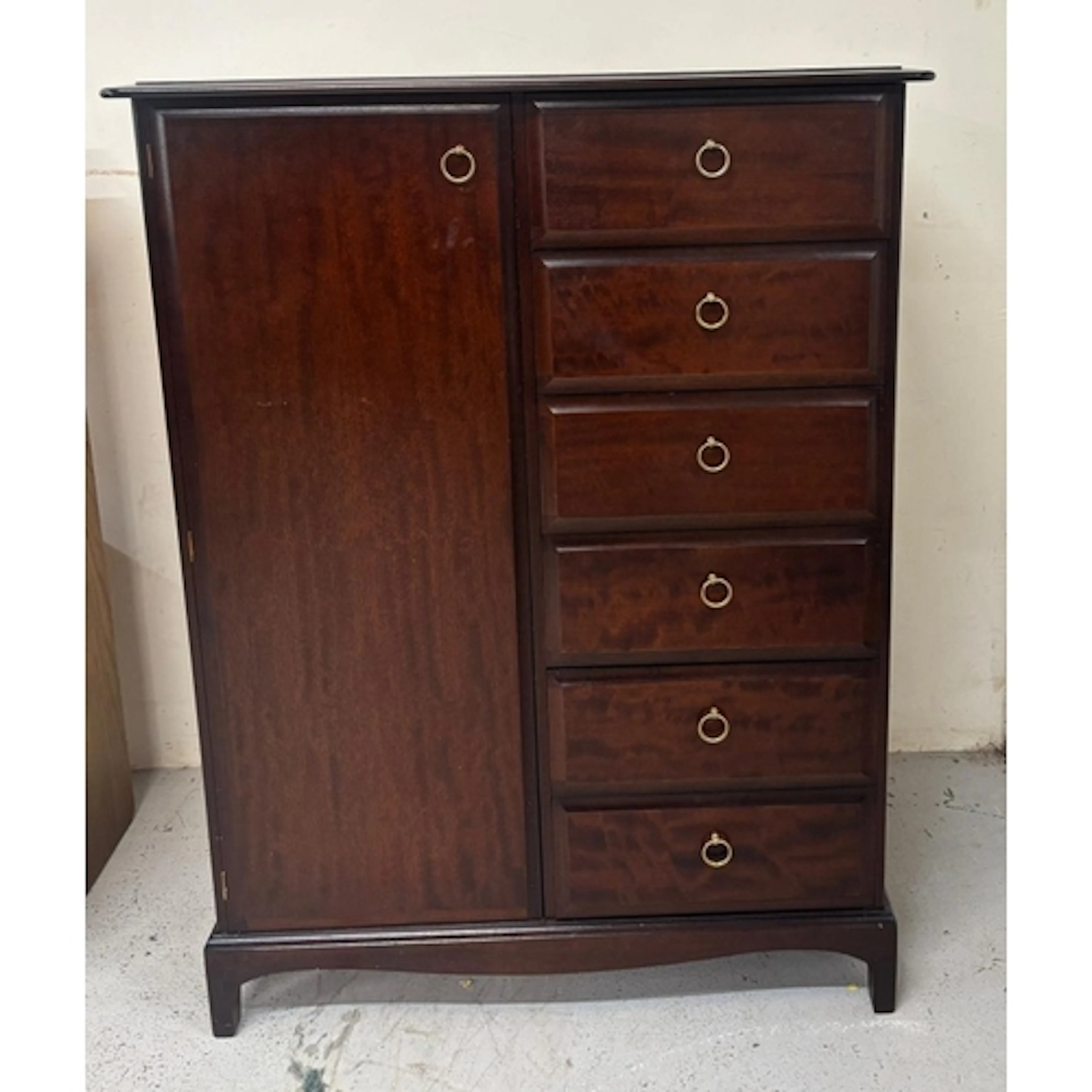 A Stag gentleman's wardrobe with hanging space and six drawe...