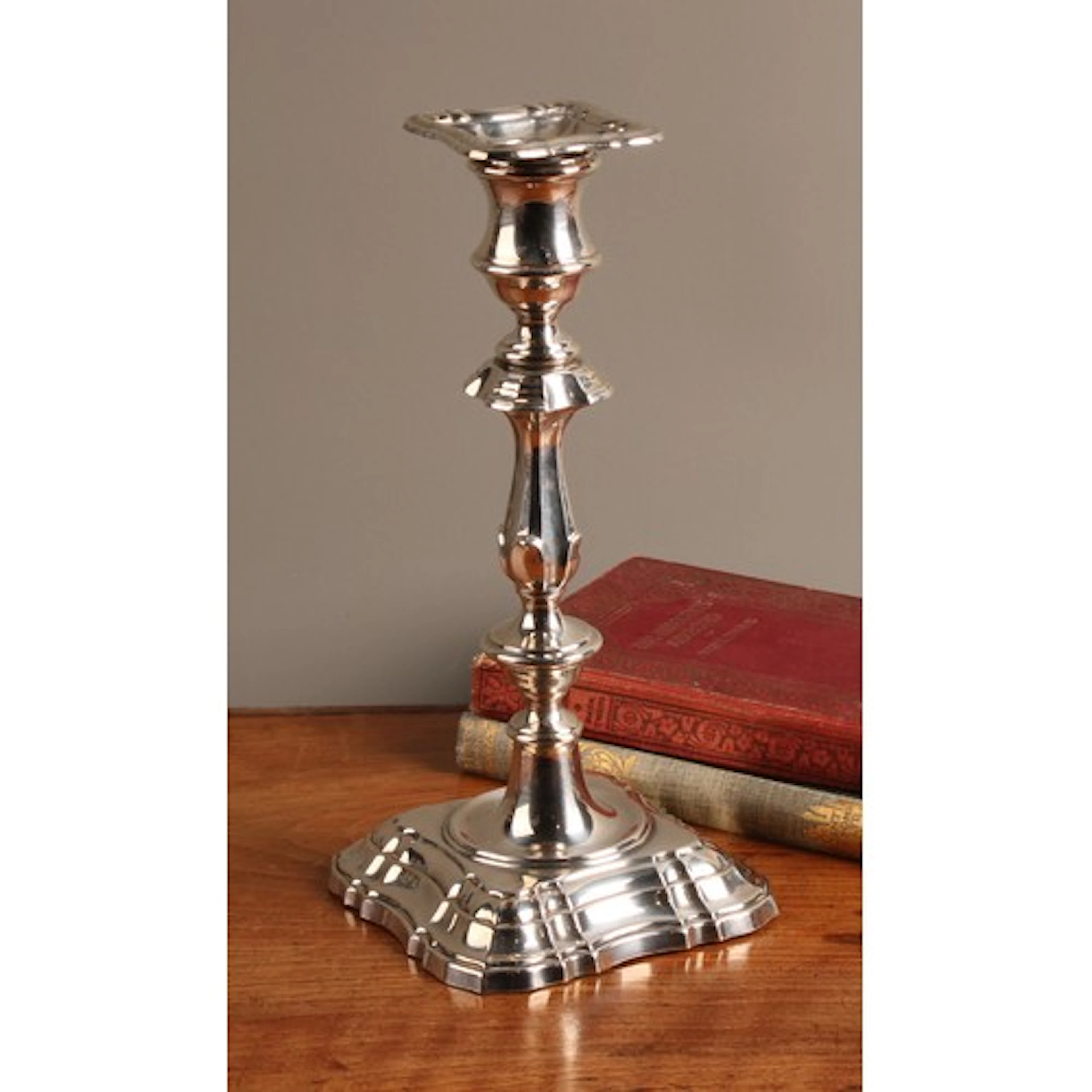 An Elizabeth II silver candlestick, of George I design, deta...
