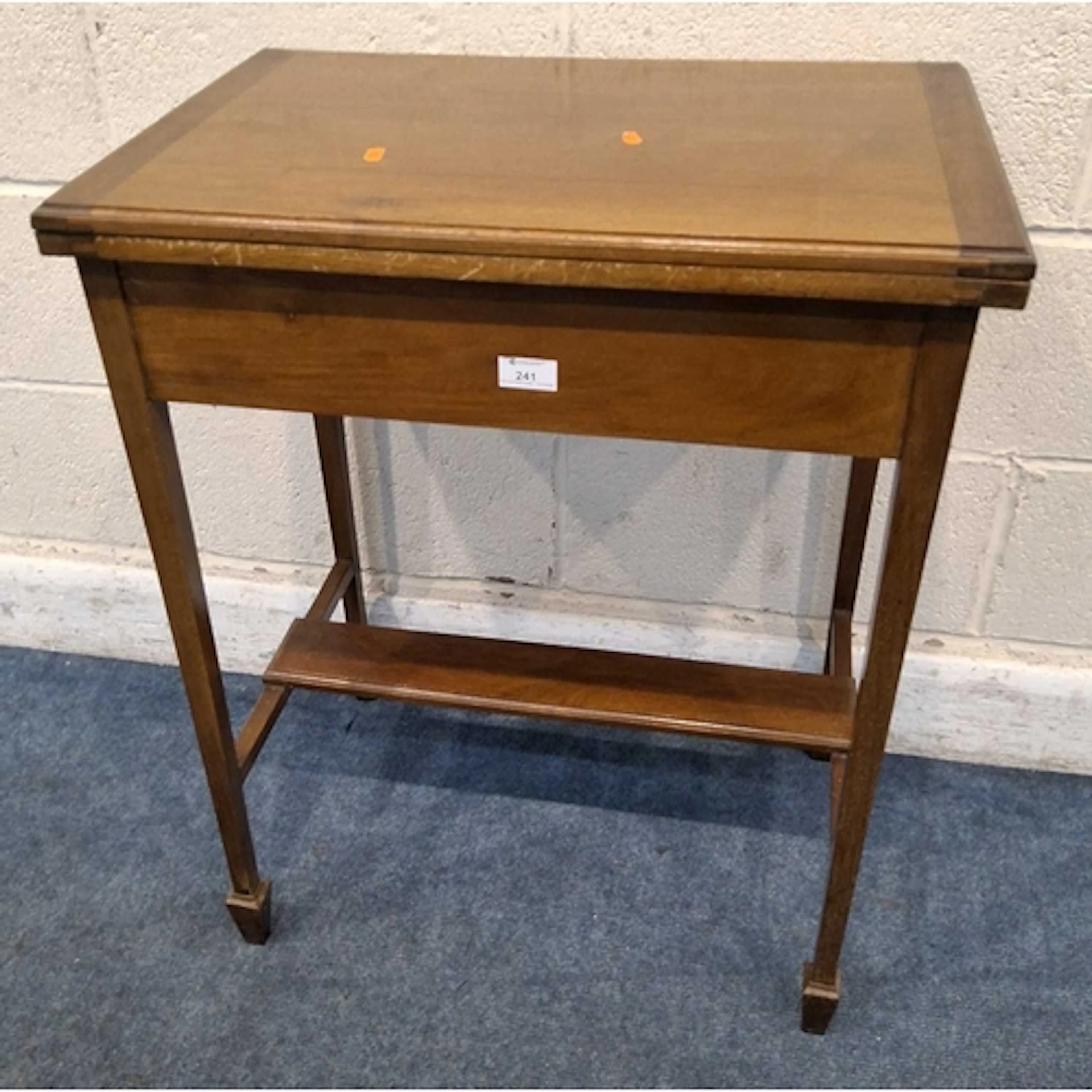 AN EARLY 20TH CENTURY GAMES / CARD TABLE, the rotating fold ...