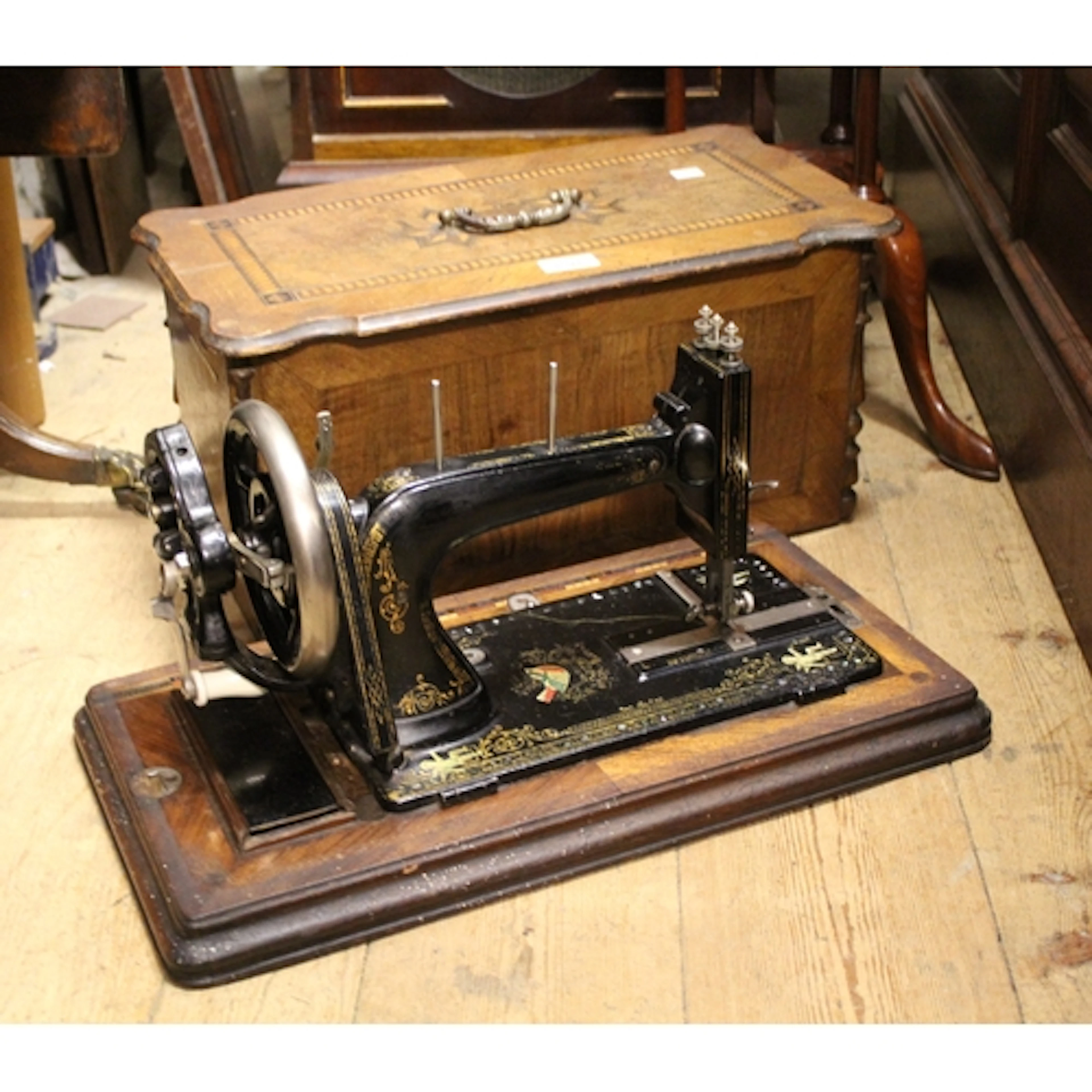 Early 20th Century wooden cased hand operated sewing machine...