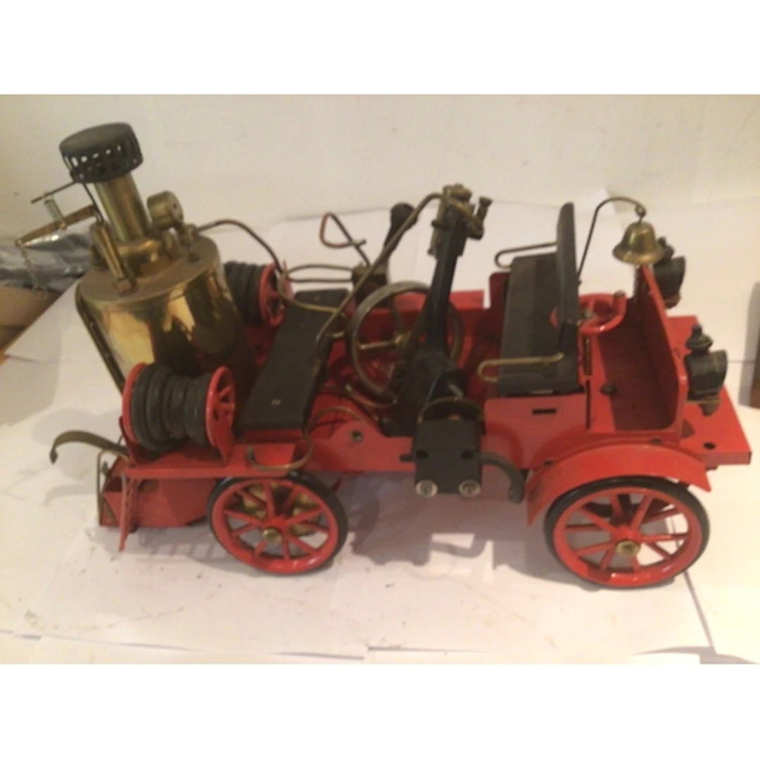 A model steam powered vintage fire engine by Wilesco, part d...