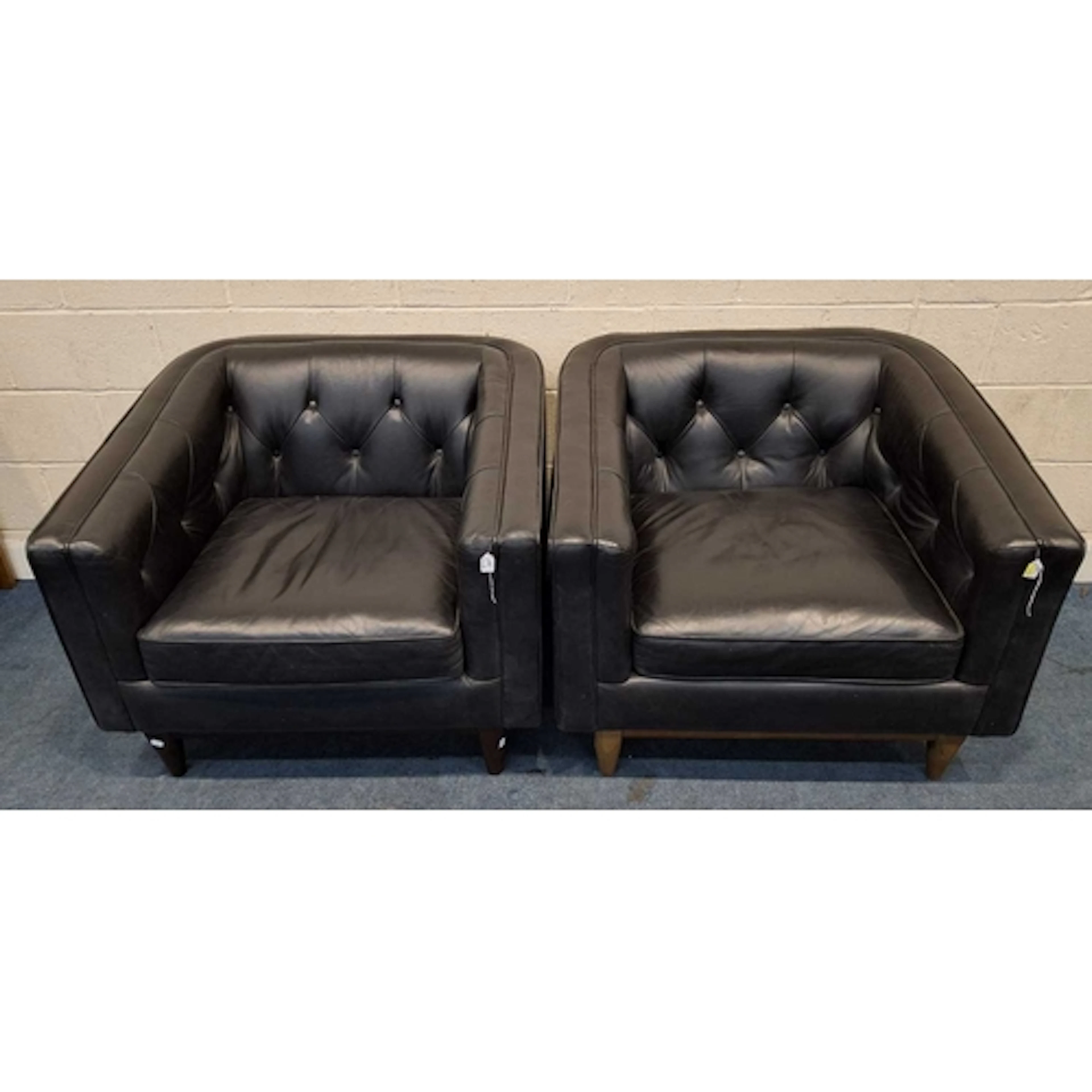 A NEAR PAIR OF TUB CHAIRS, with black buttoned leather uphol...