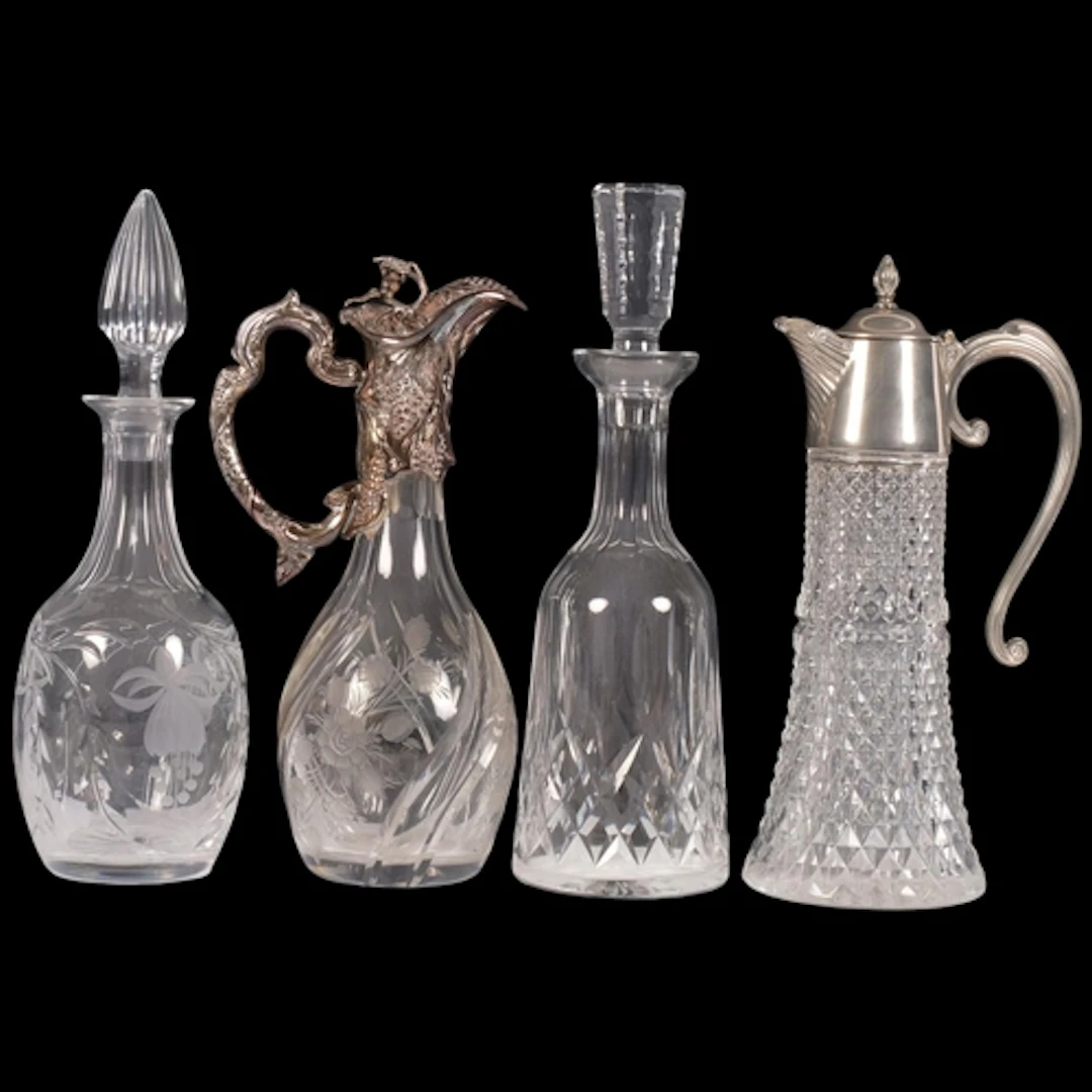 A collection of cut-glass decanters and Claret jugs, with si...
