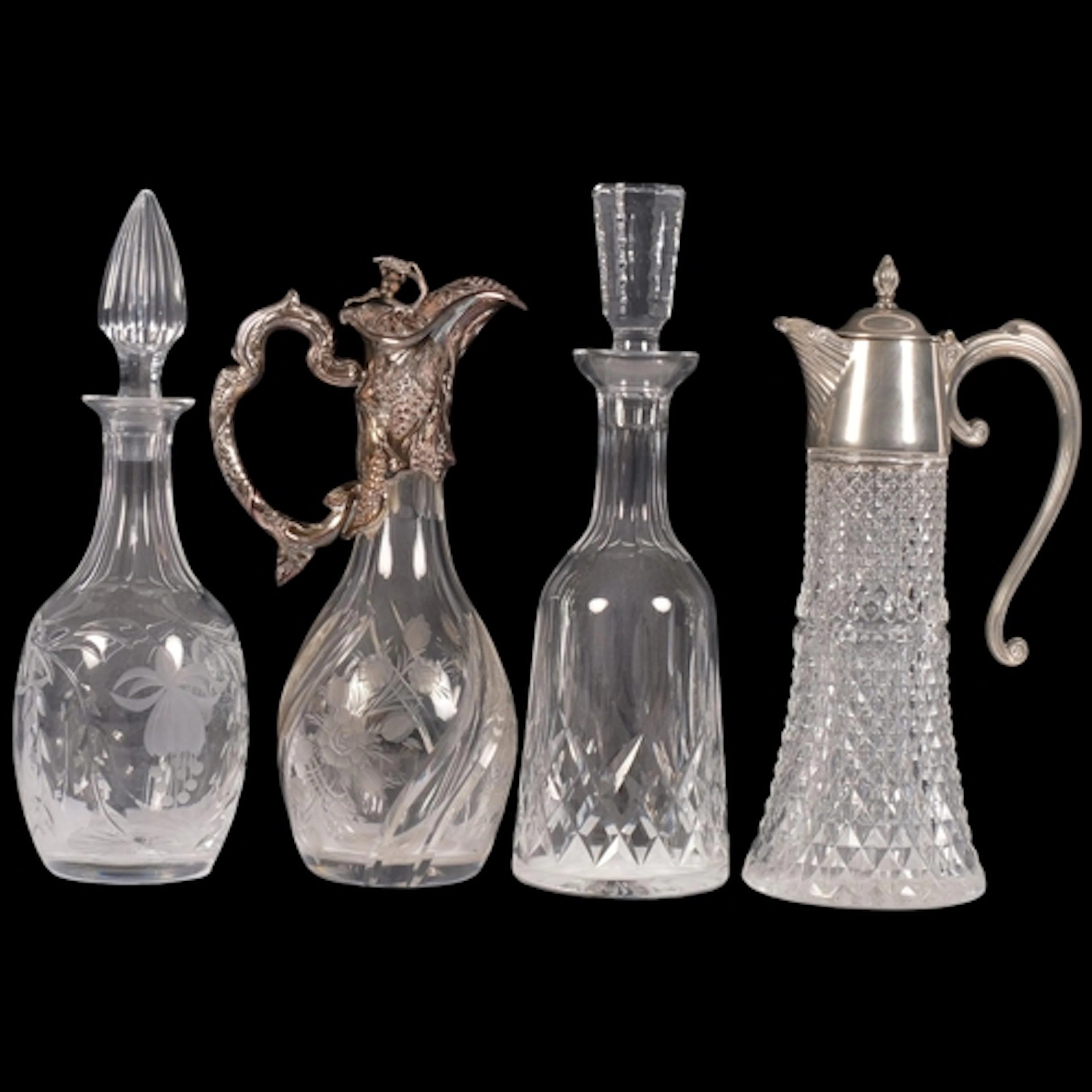 A collection of cut-glass decanters and Claret jugs, with si...