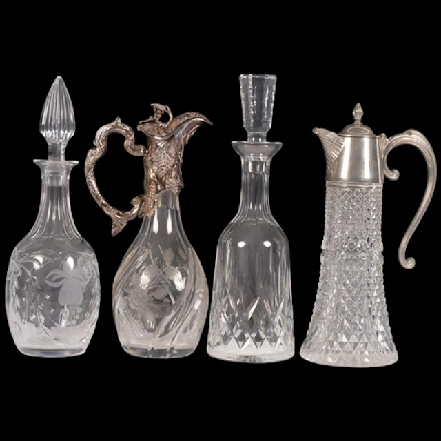 A collection of cut-glass decanters and Claret jugs, with si...