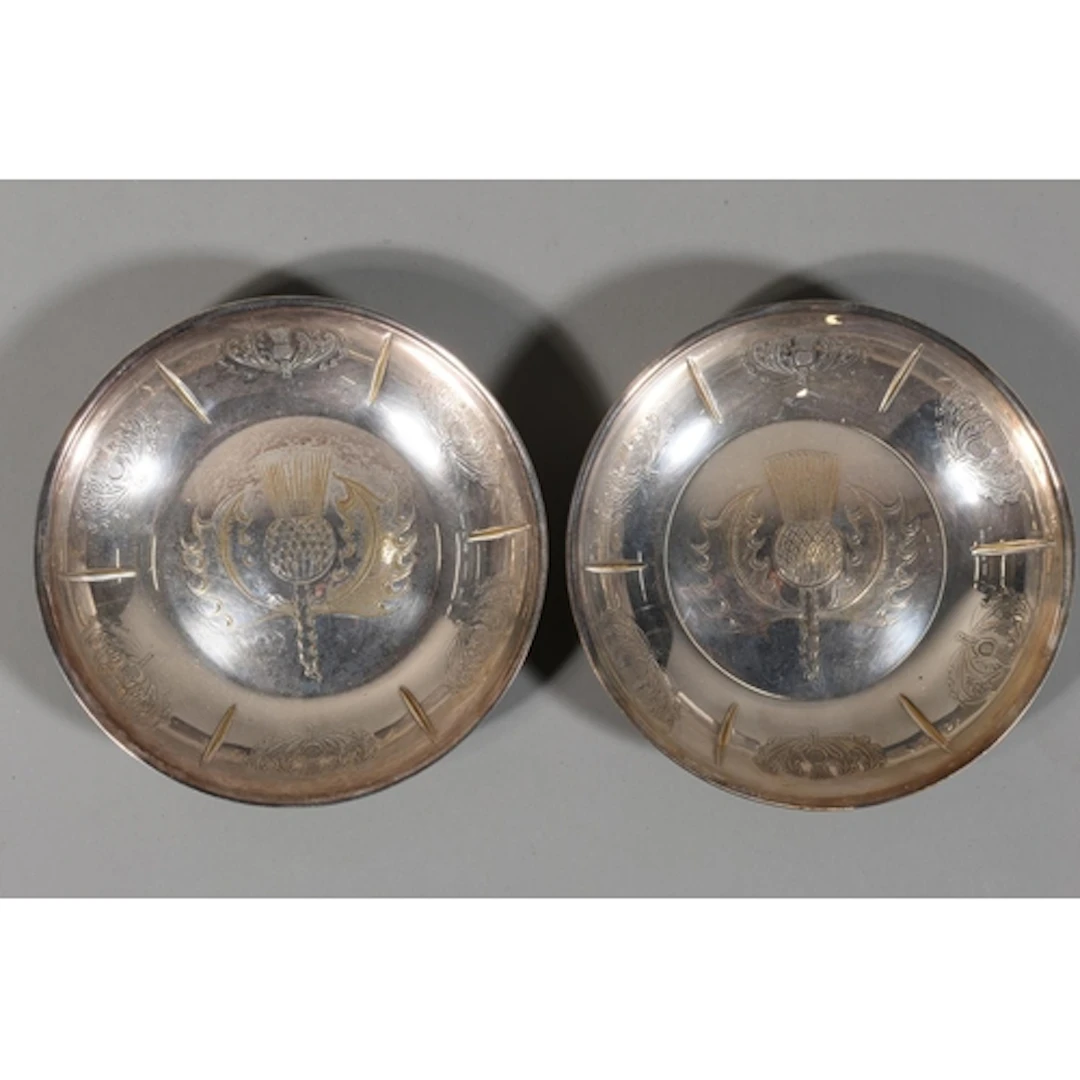 Pair of silver plated brass dishes decorated with Scottish t...