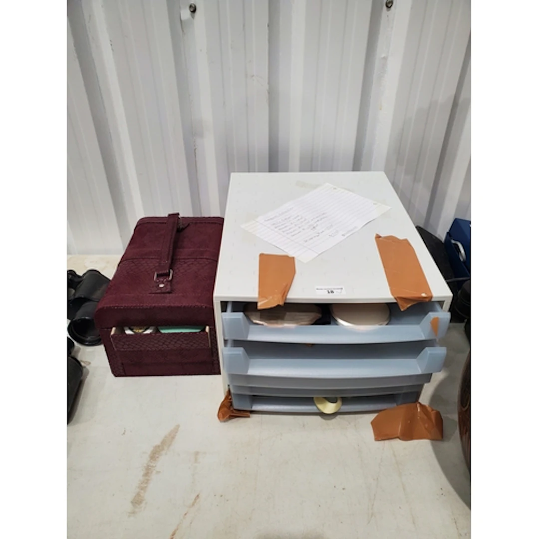 A plastic Case and a leather effect Case containing a collec...