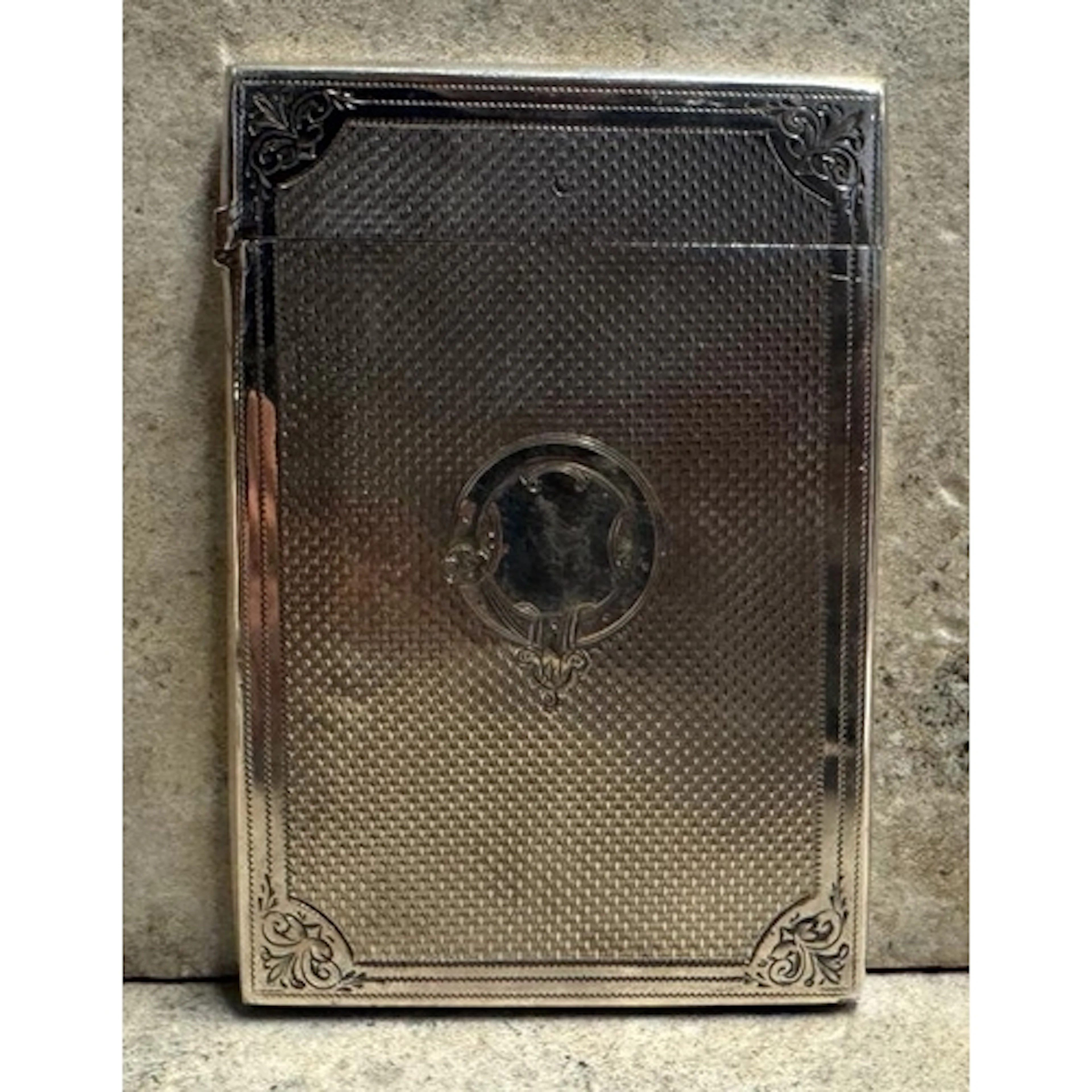 A Victorian silver card case with engraved decoration. Birmi...