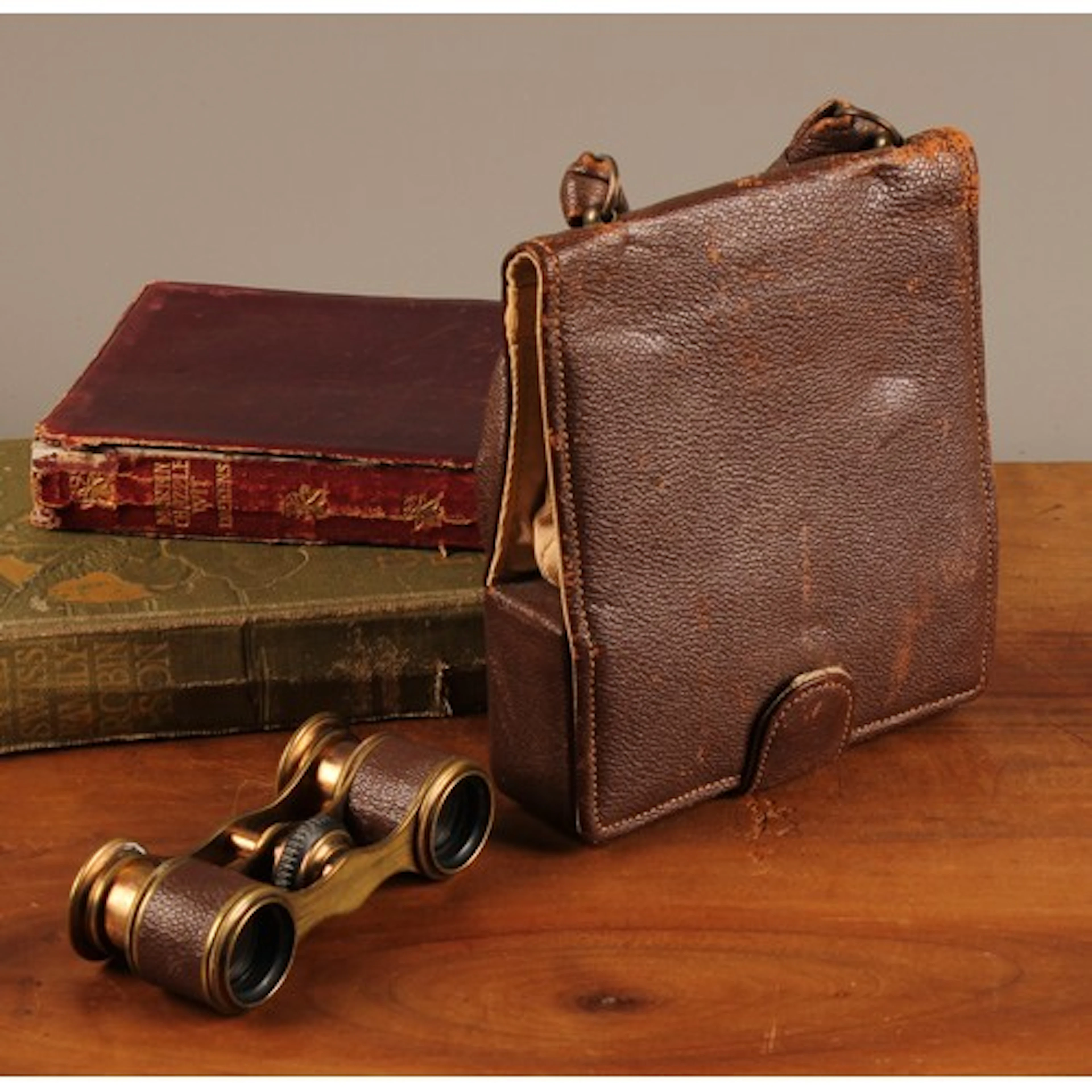 A pair of French brass and leather bound opera glasses, poss...
