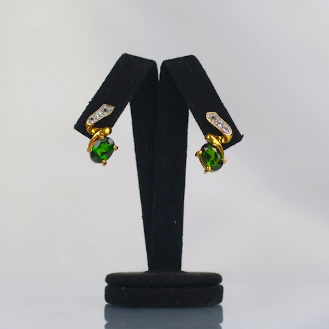 A pair of contemporary chrome diopside earrings, the oval cu...