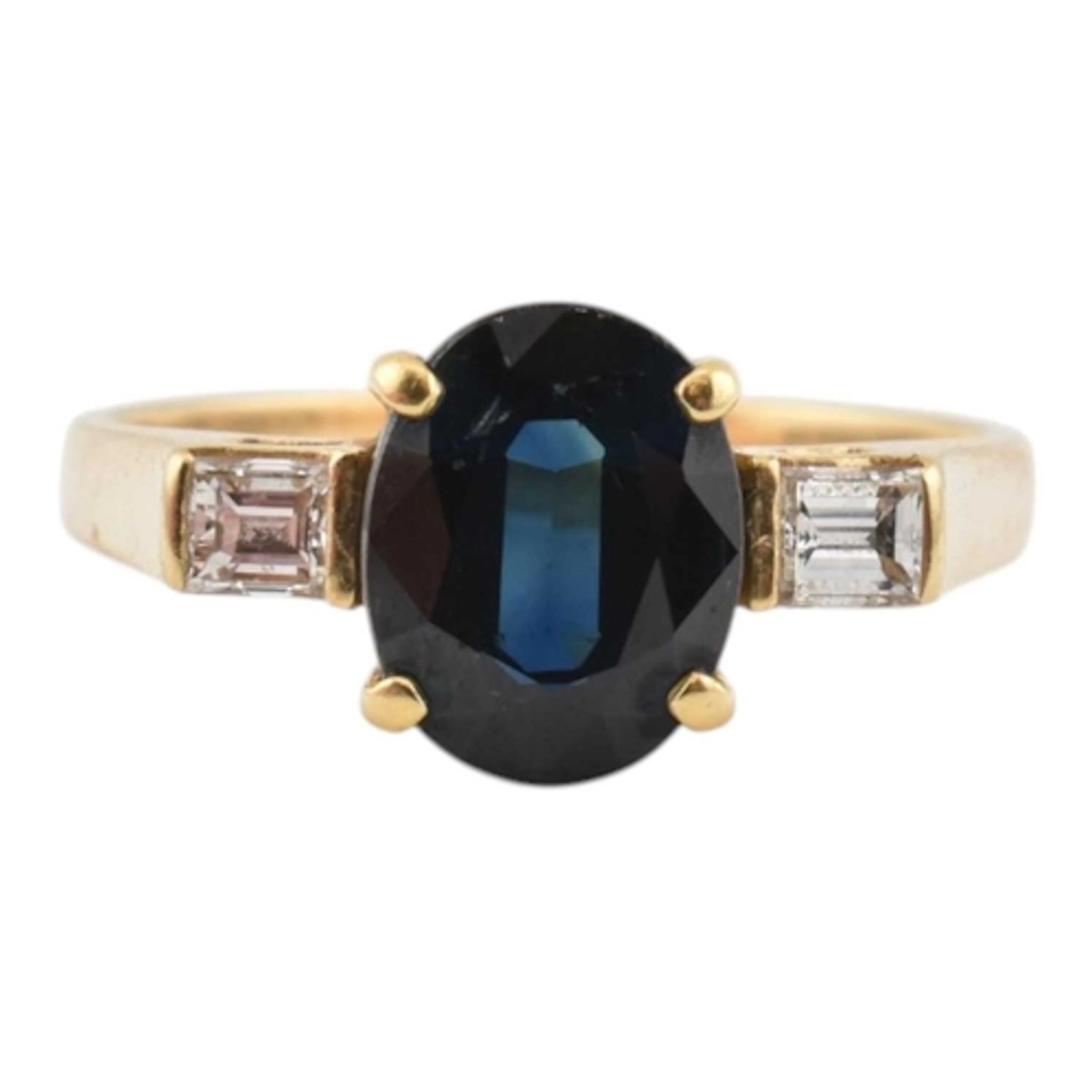 An 18ct gold sapphire and diamond ring. The ring set with a ...