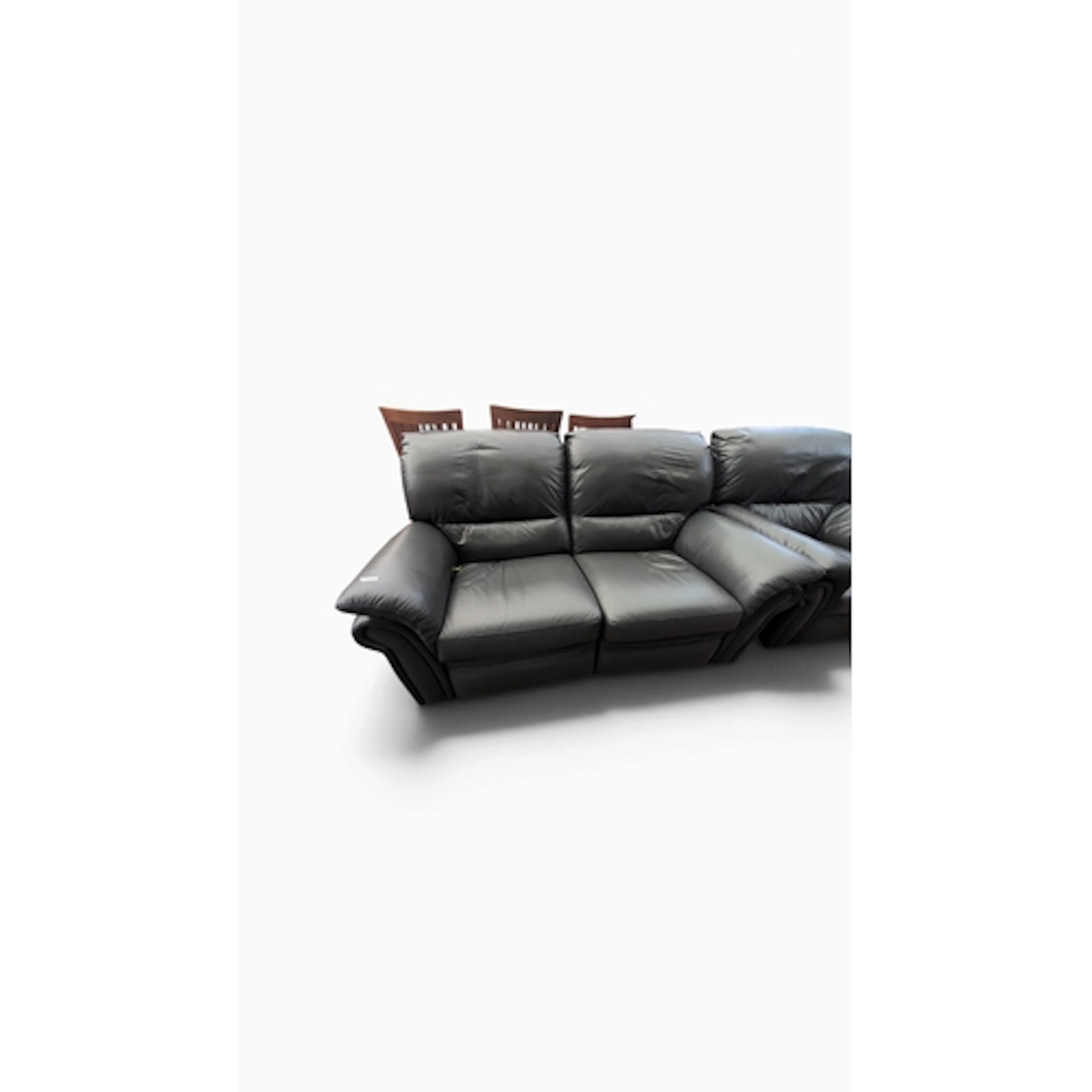 Two-seat manual recliner sofa upholstered in black leather, ...