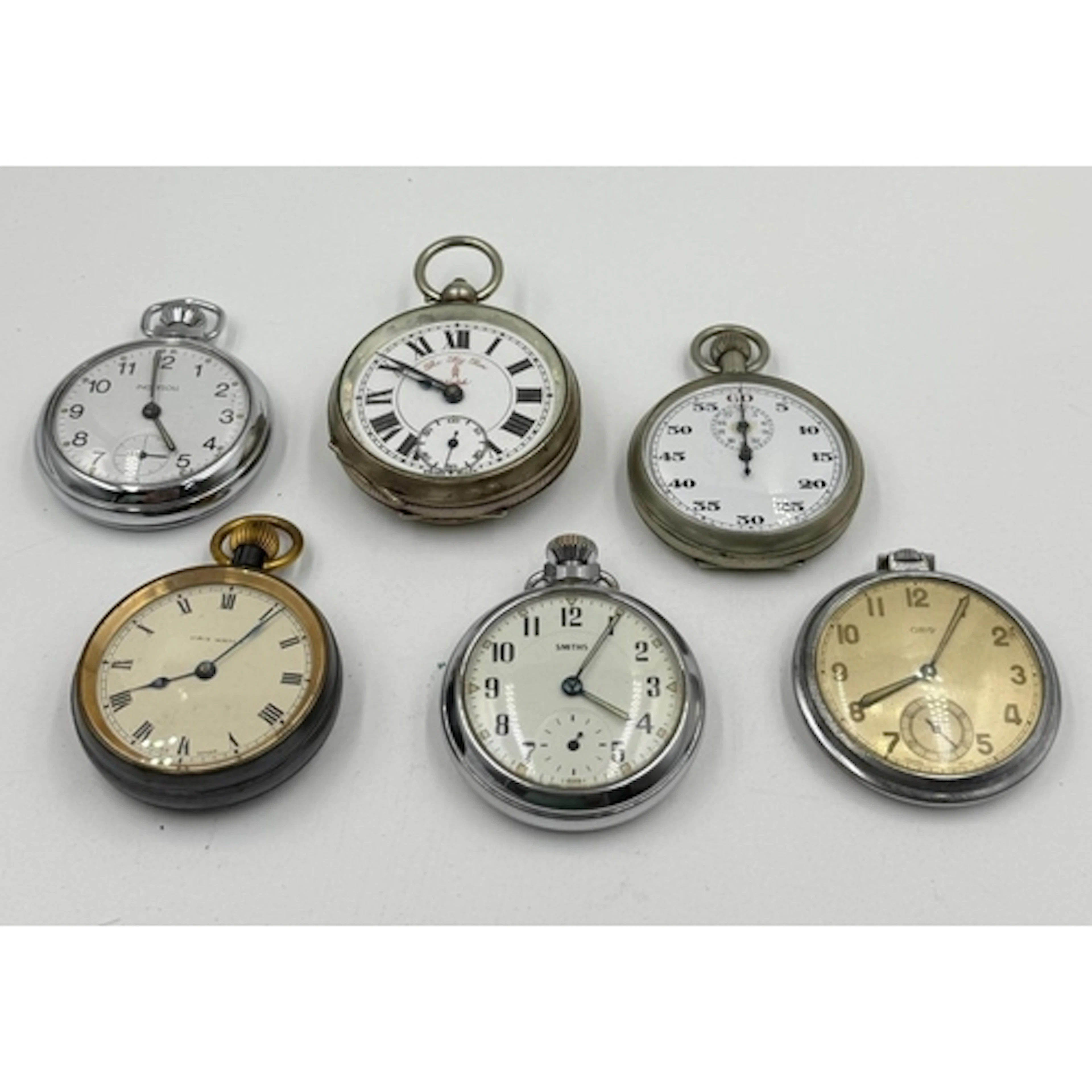 A selection of six pocket watches and stop watches.