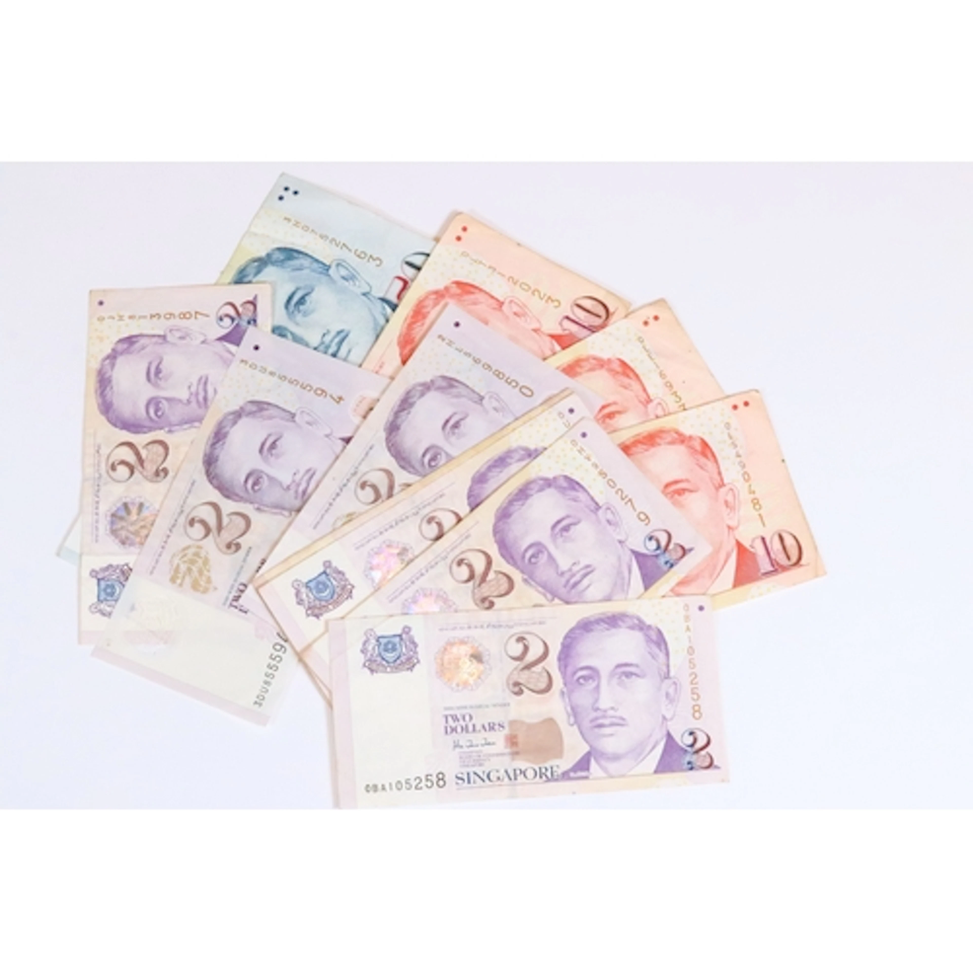 A collection of eleven Singapore banknotes of various denomi...