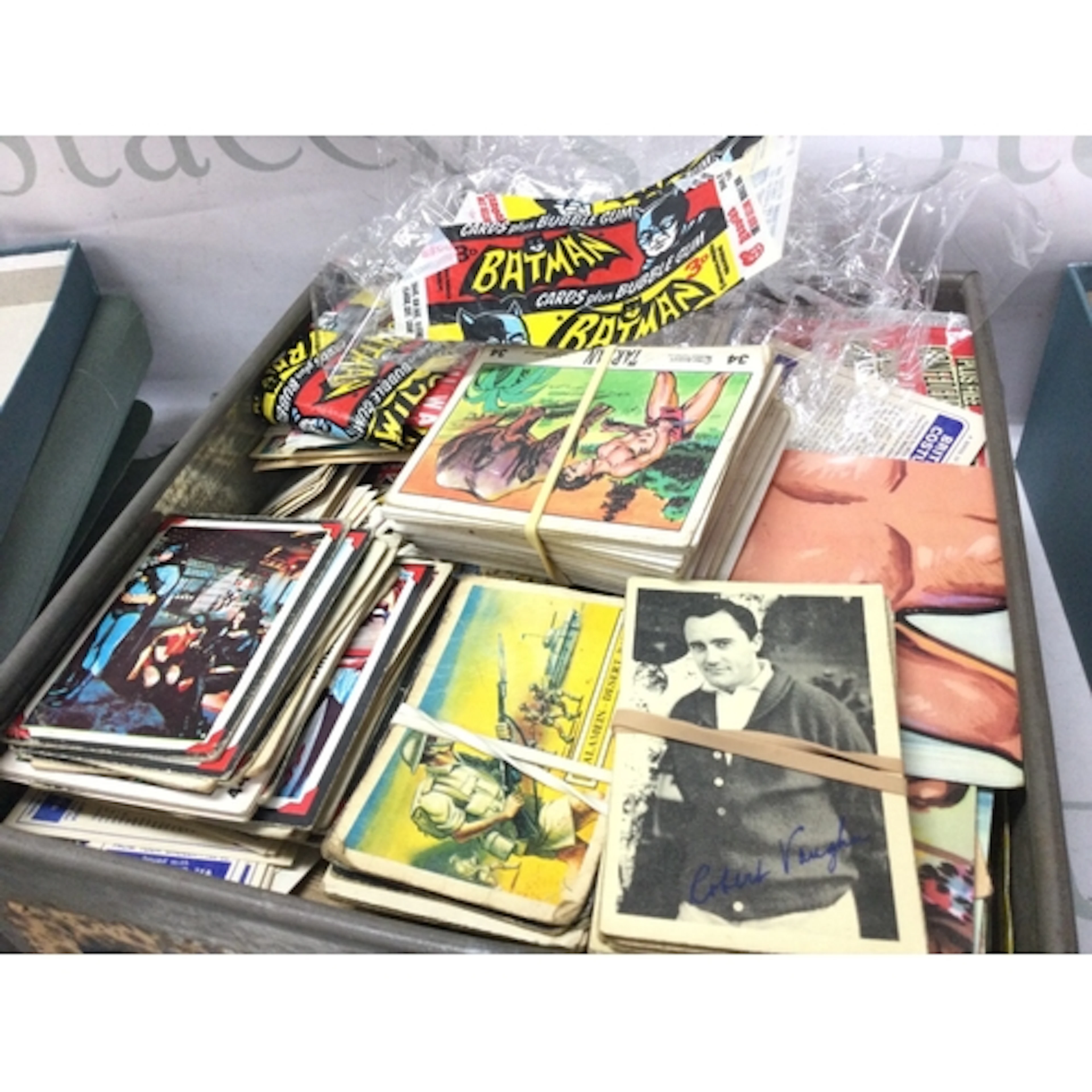 A collection of trade bubble gum cards including topps batma...