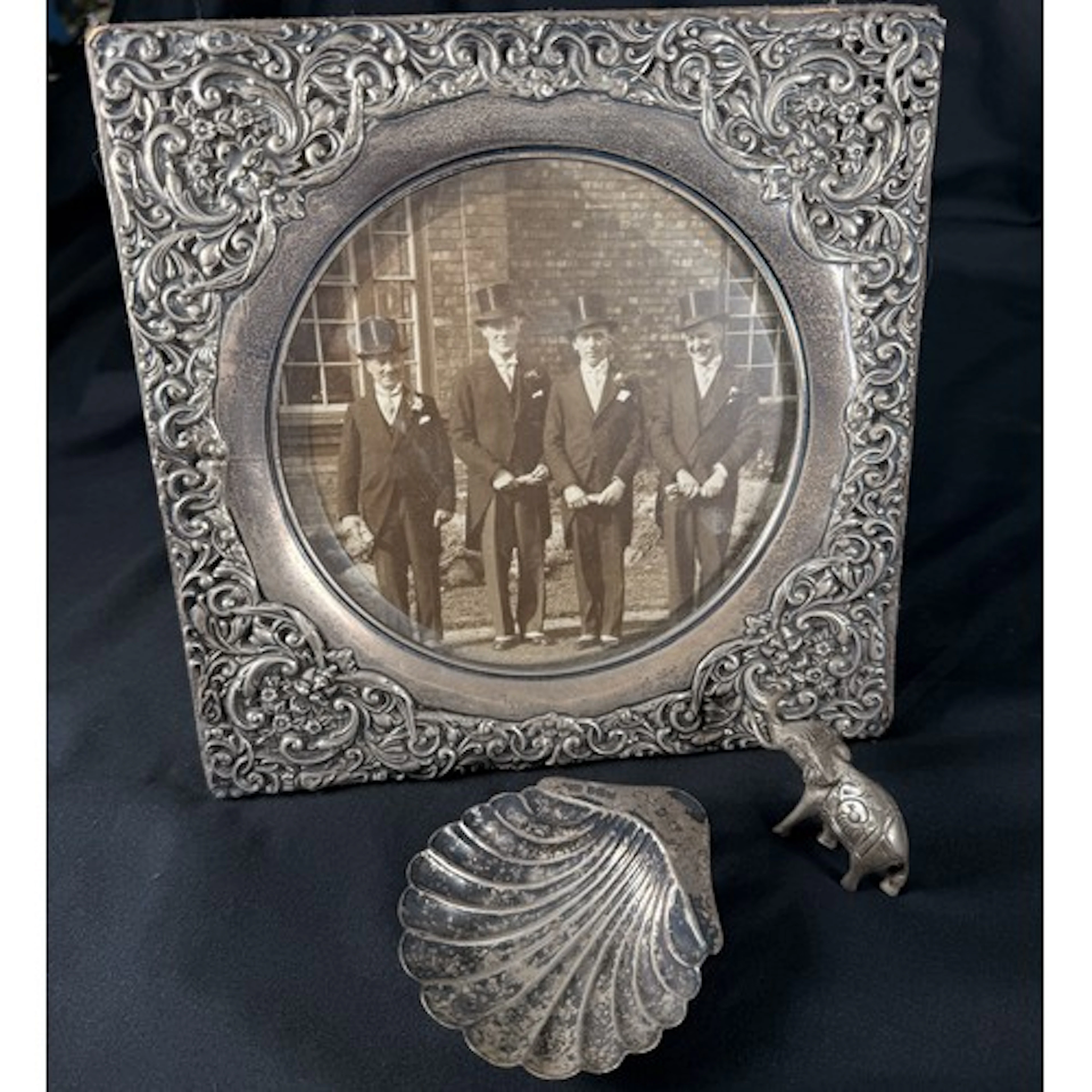 A Victorian heavily embossed hallmarked silver photo frame; ...