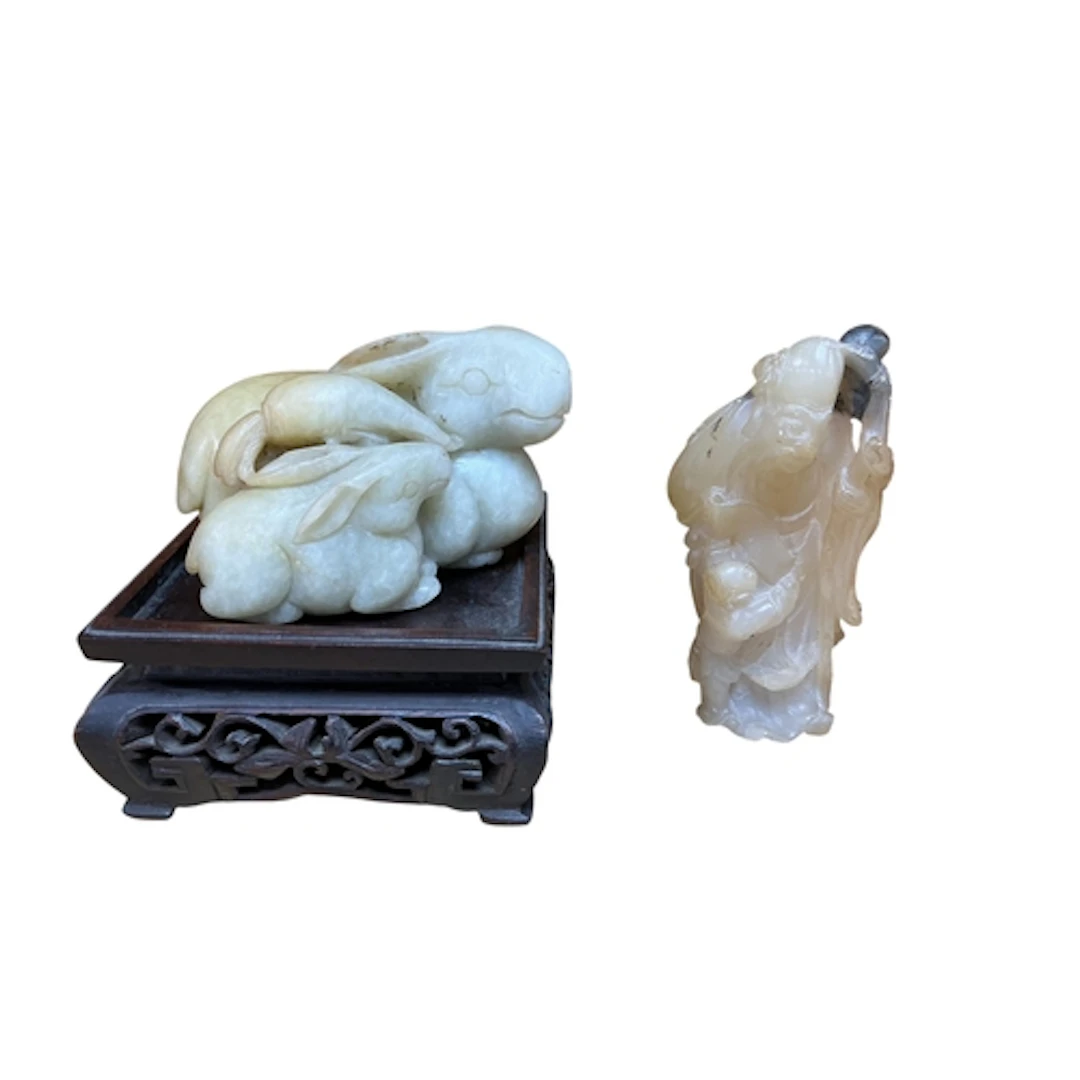 A Chinese jade group of rabbits and a soapstone group of Sho...