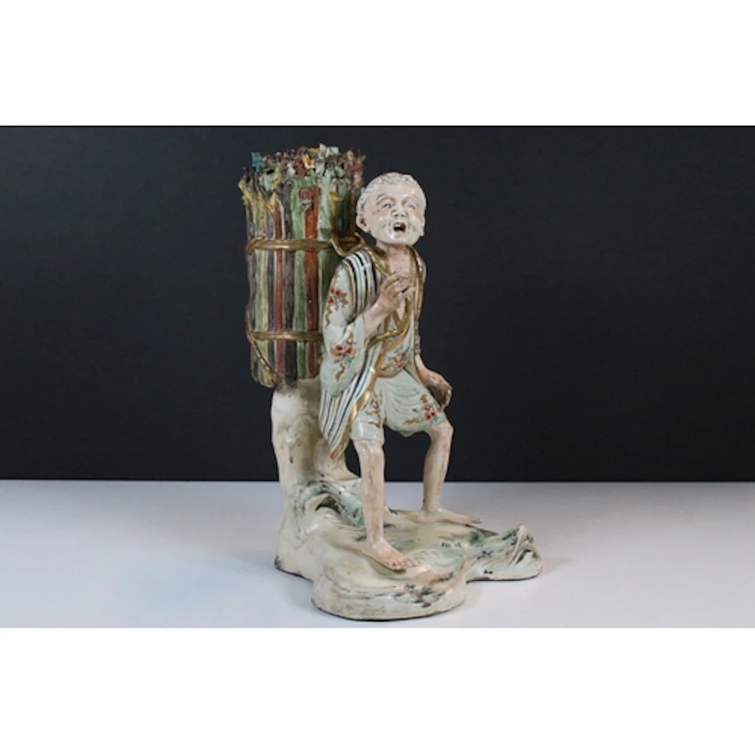 Late 19th century Japanese pottery figure of a harvester, mo...