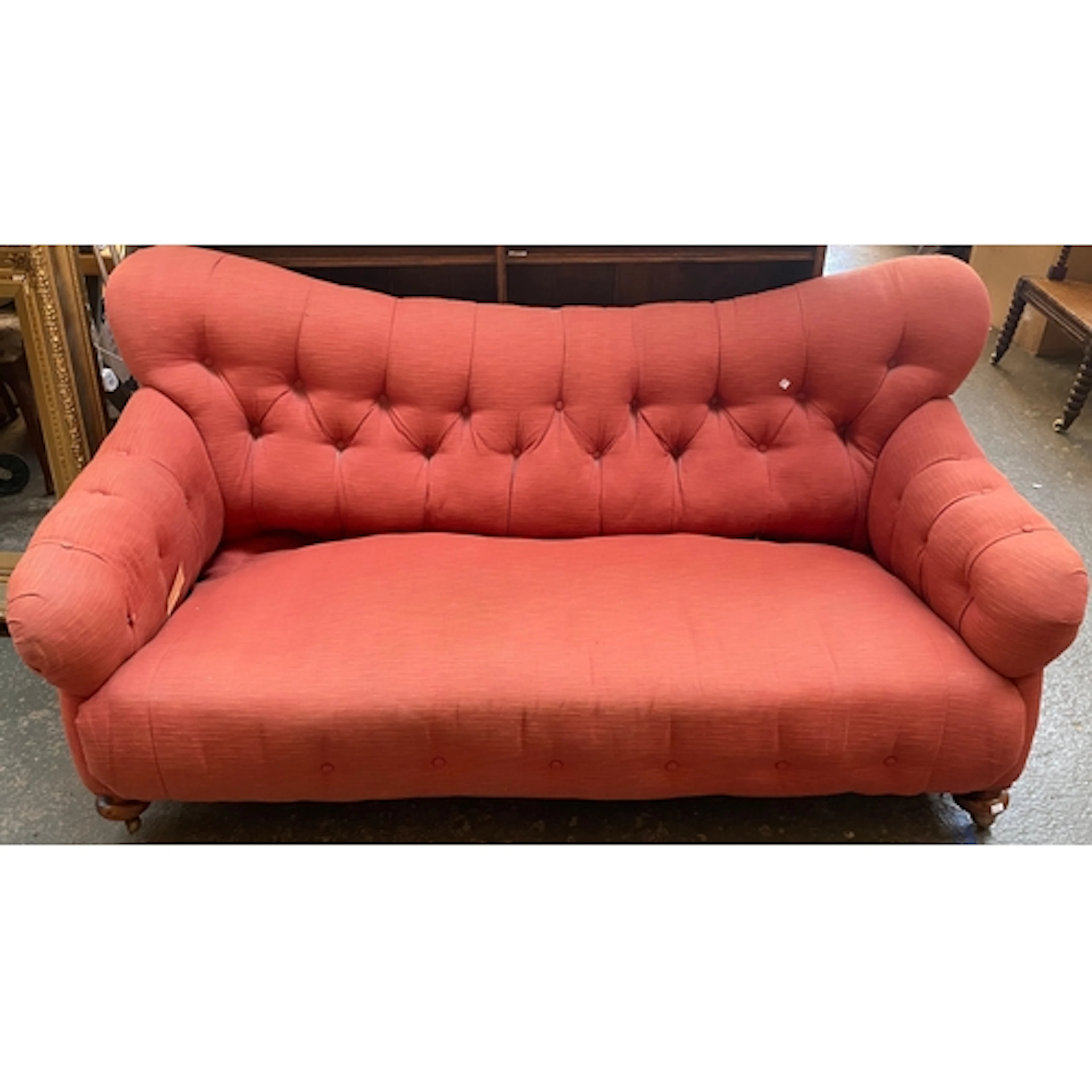 A good deep country house button upholstered sofa in red, 18...