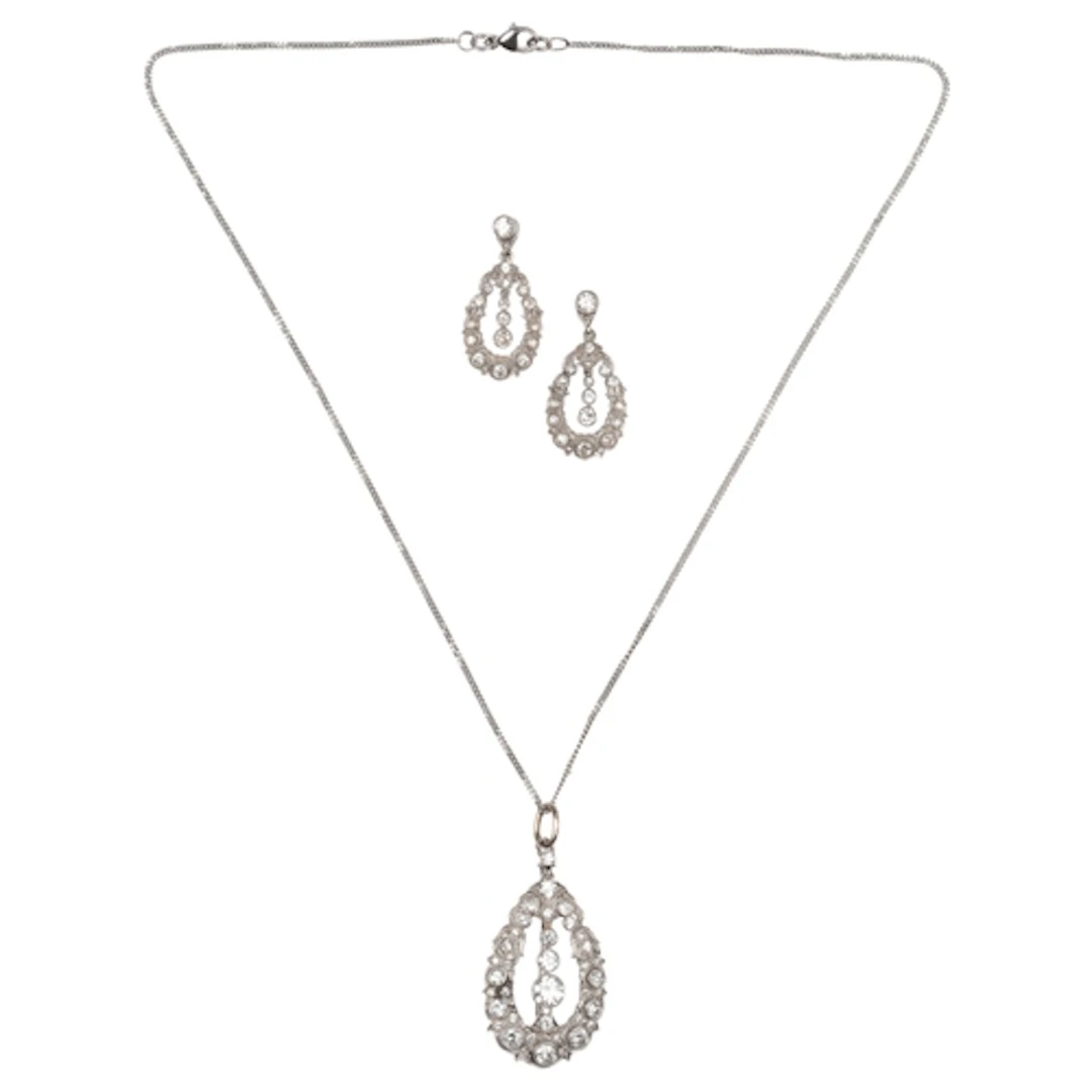 A diamond pendant/brooch and earrings, early-mid 20th centur...