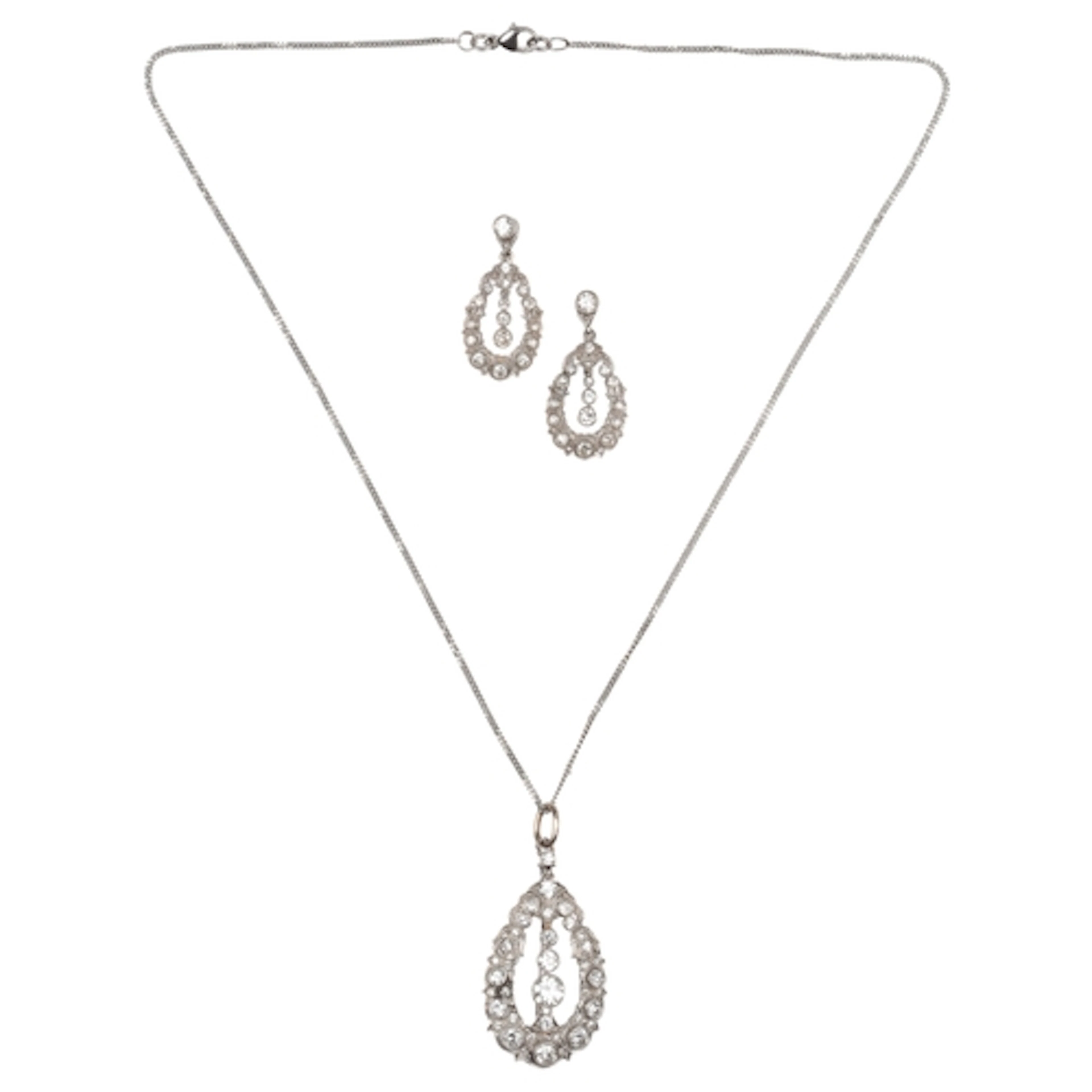 A diamond pendant/brooch and earrings, early-mid 20th centur...