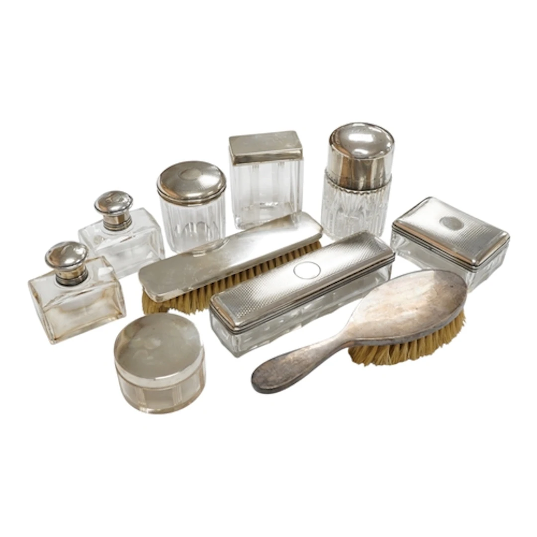 A group of seven assorted French white metal mounted glass t...