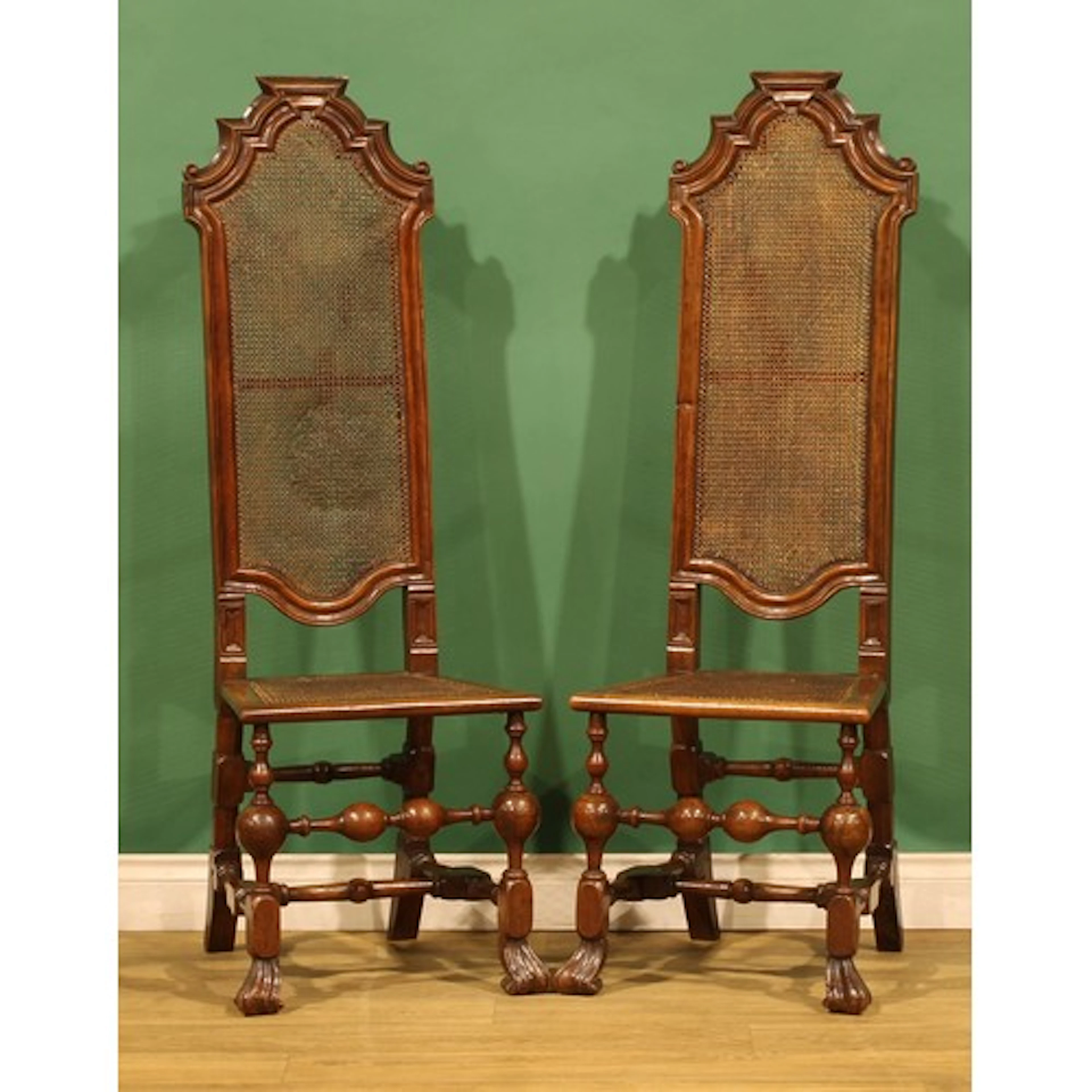 A pair of William & Mary walnut side chairs, cane back and s...
