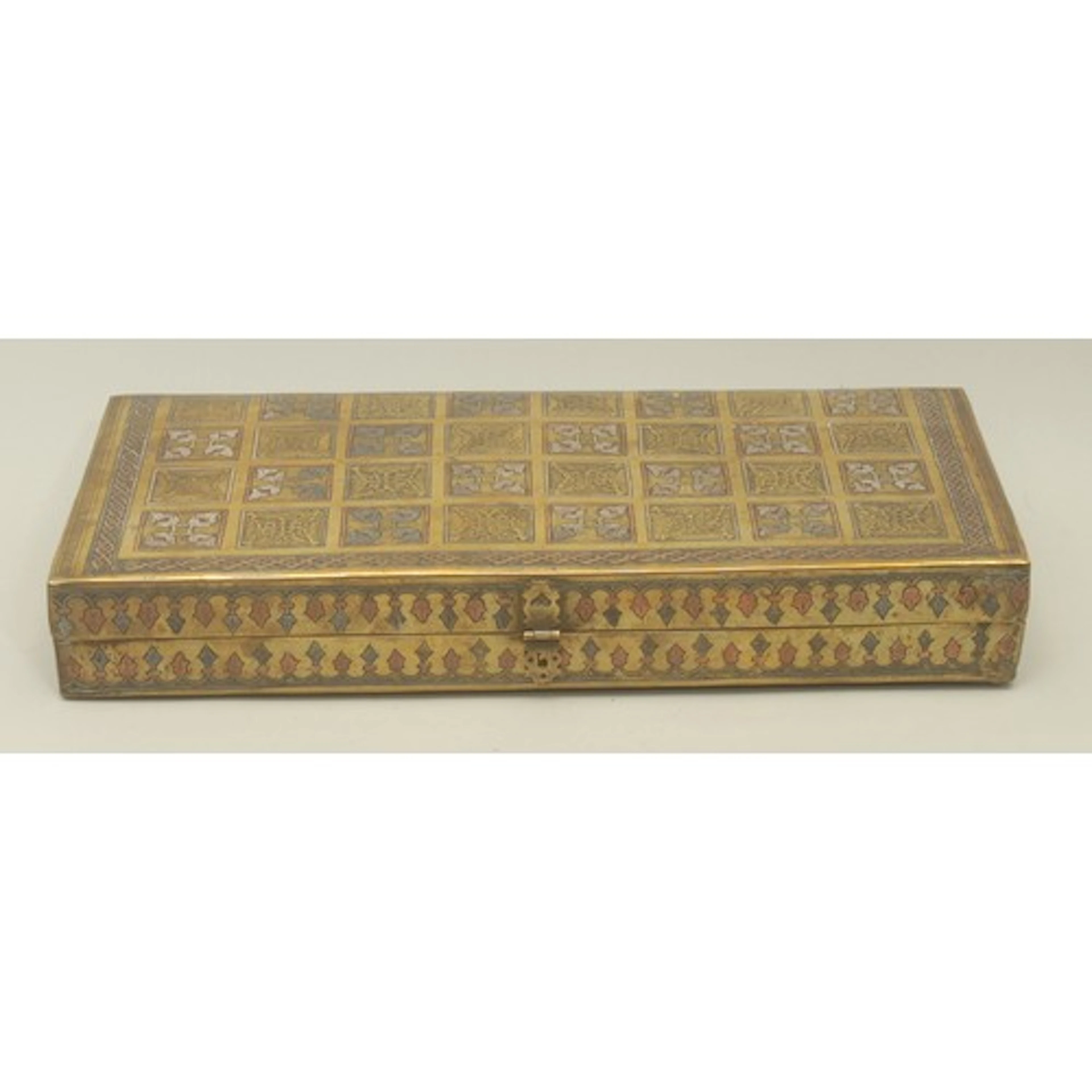 A Middle Eastern silver and copper damascened brass games bo...
