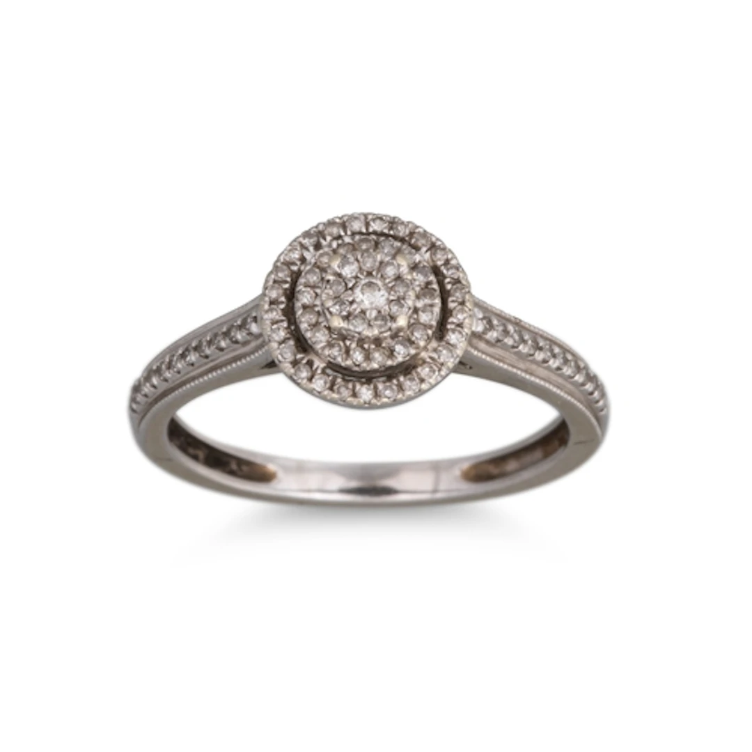 A DIAMOND SET CLUSTER RING, diamond set shoulders, mounted i...