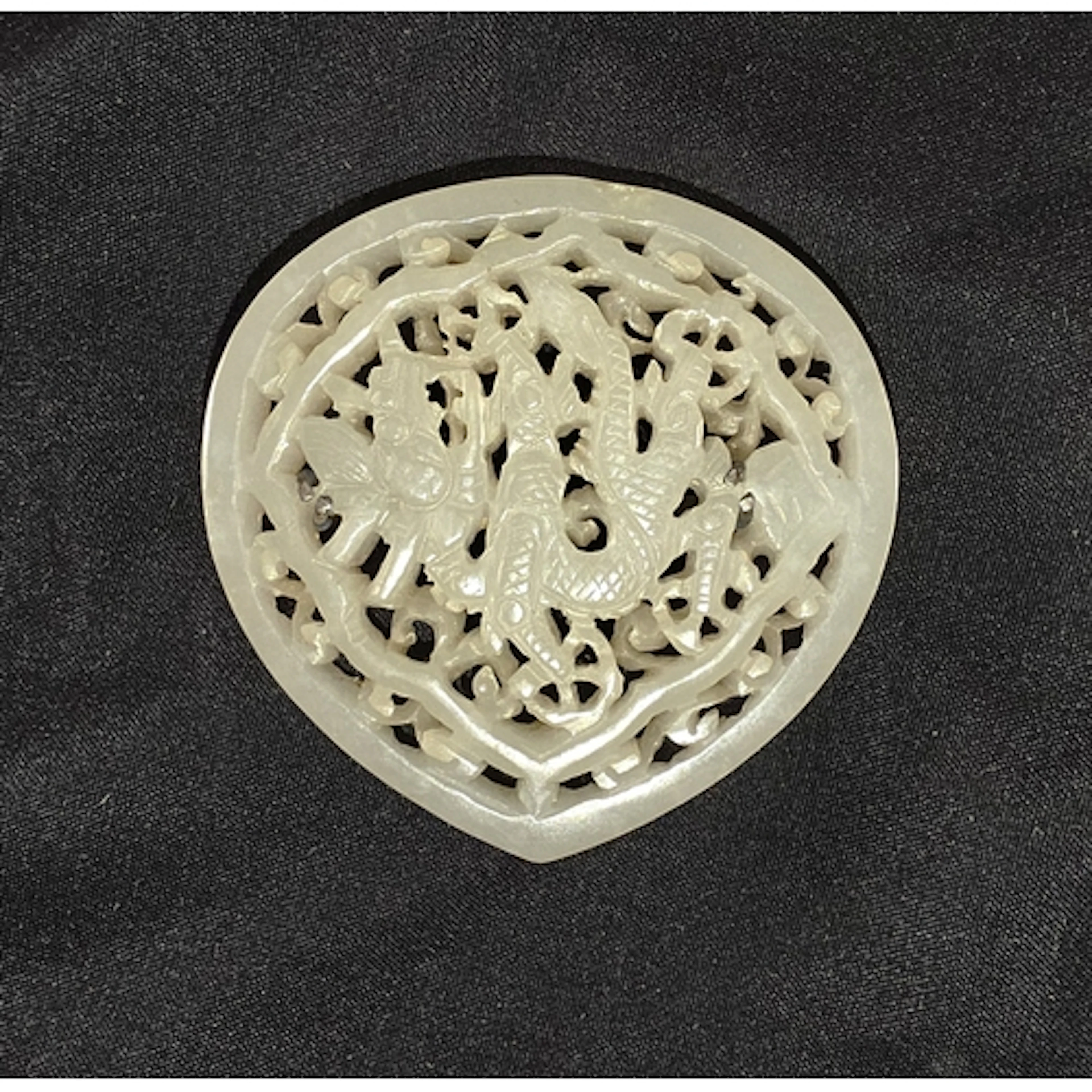 A Chinese 18/19th century reticulated white jade 'Dragon' Pl...