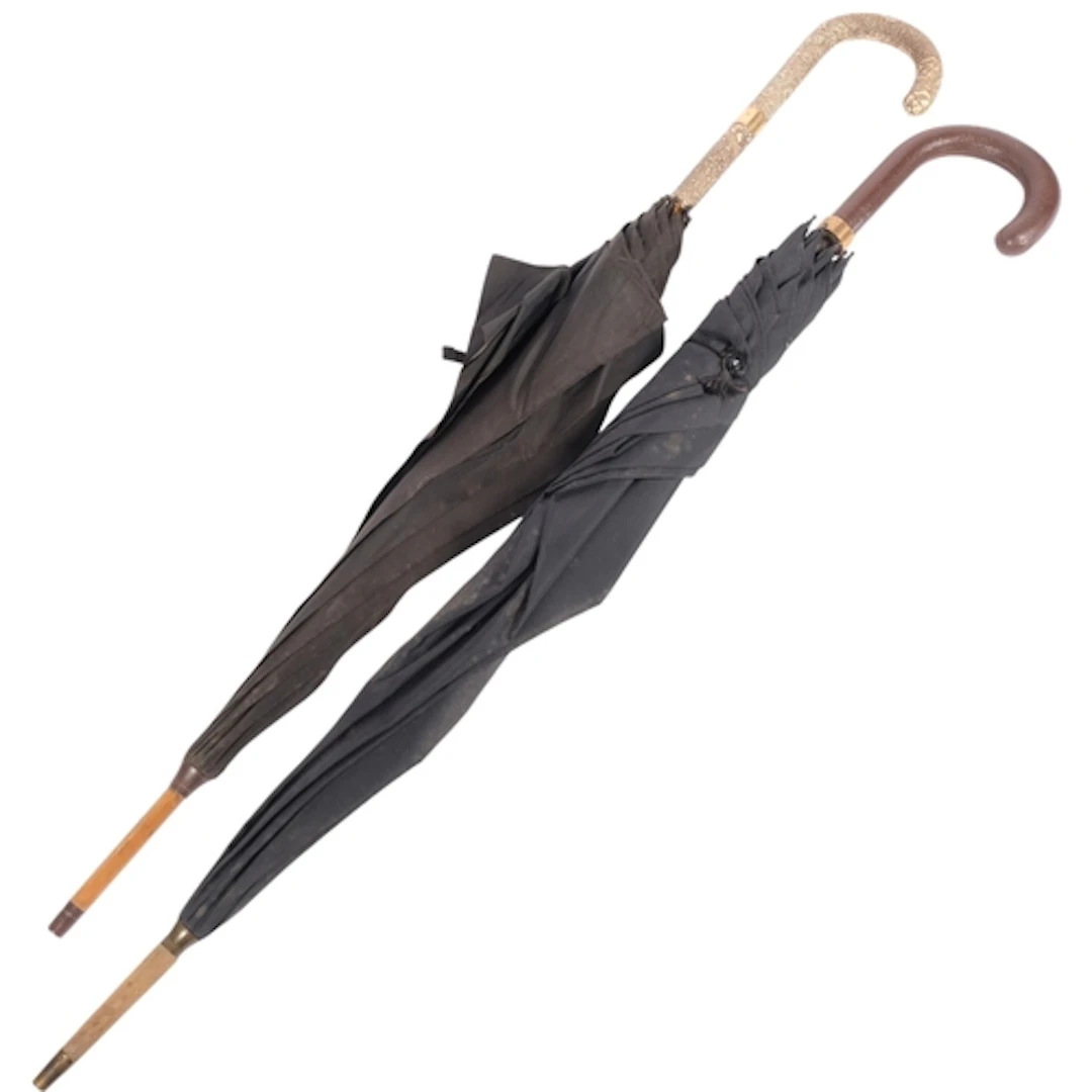 A 1950s Brigg Of London umbrella, with snakeskin handle and ...