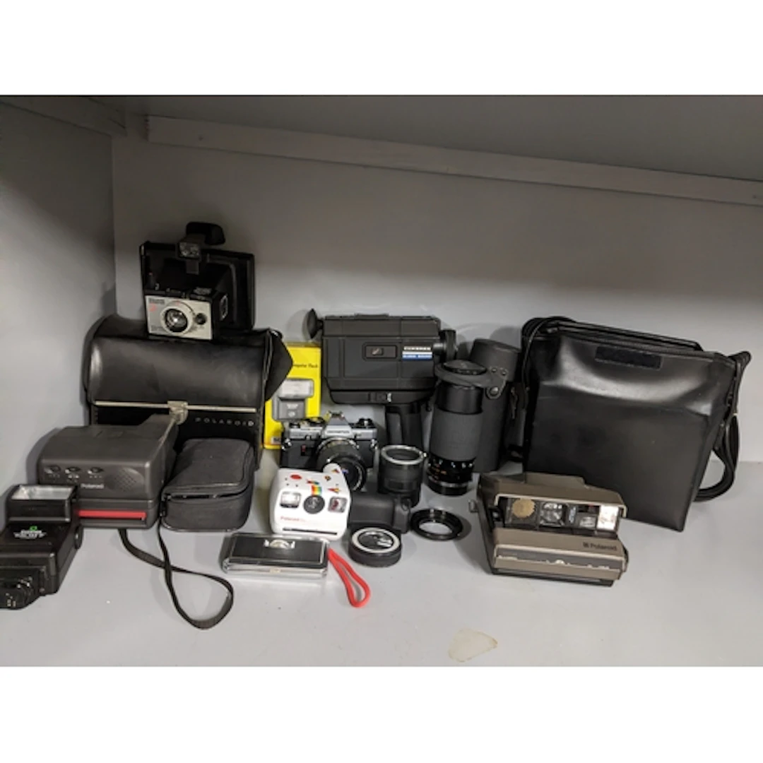 A mixed group of film cameras and accessories to include a P...
