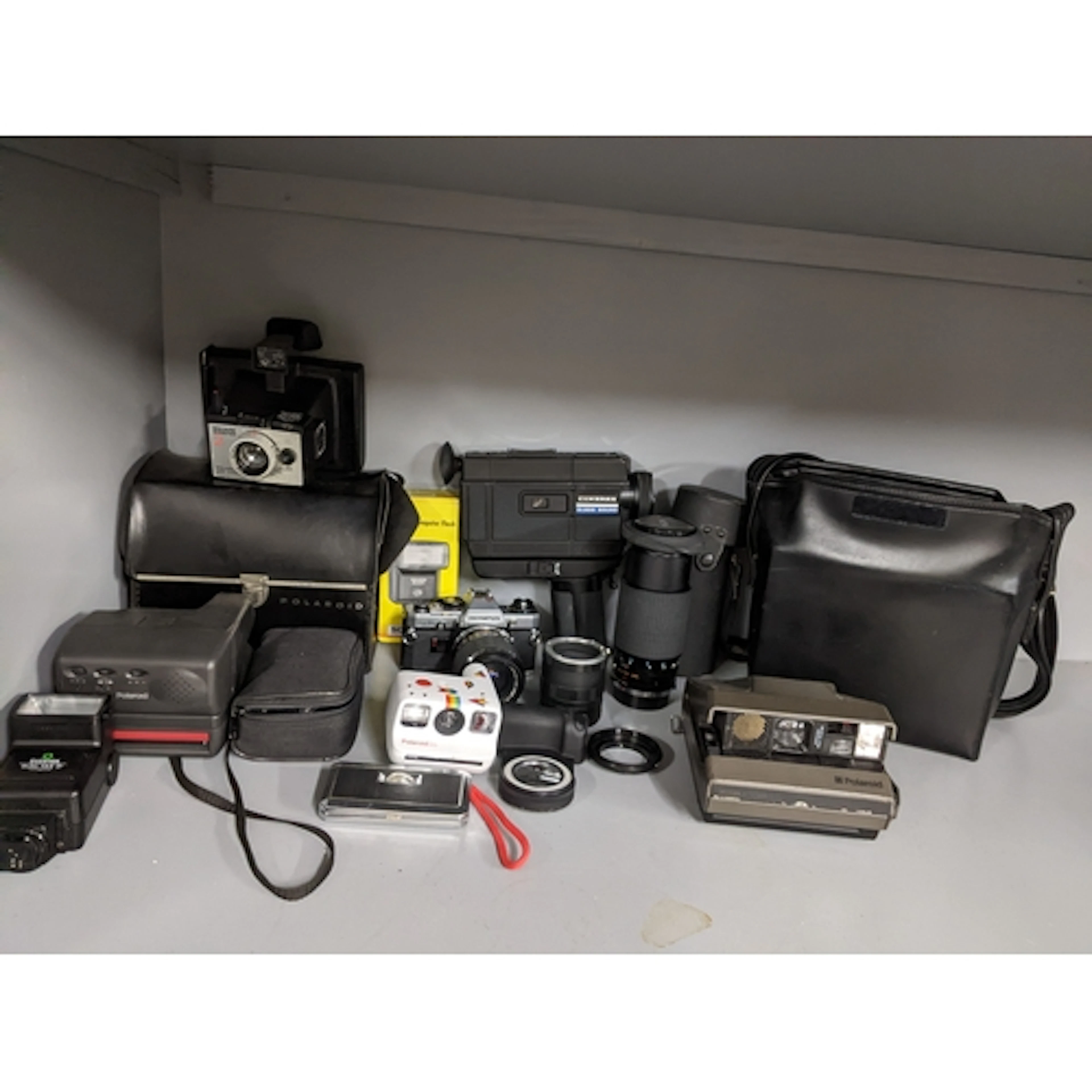 A mixed group of film cameras and accessories to include a P...