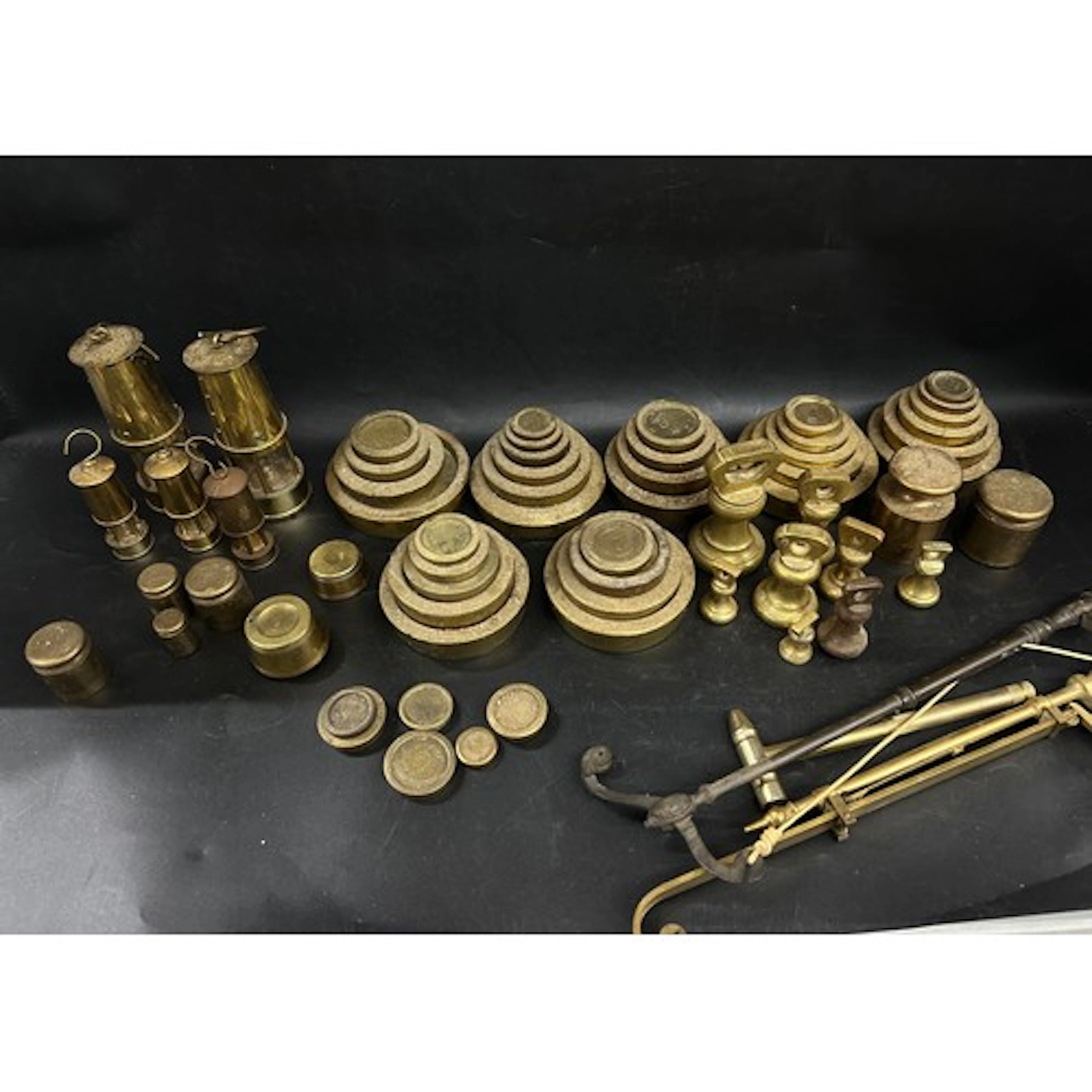 A collection of various sets of brass weights, two small min...